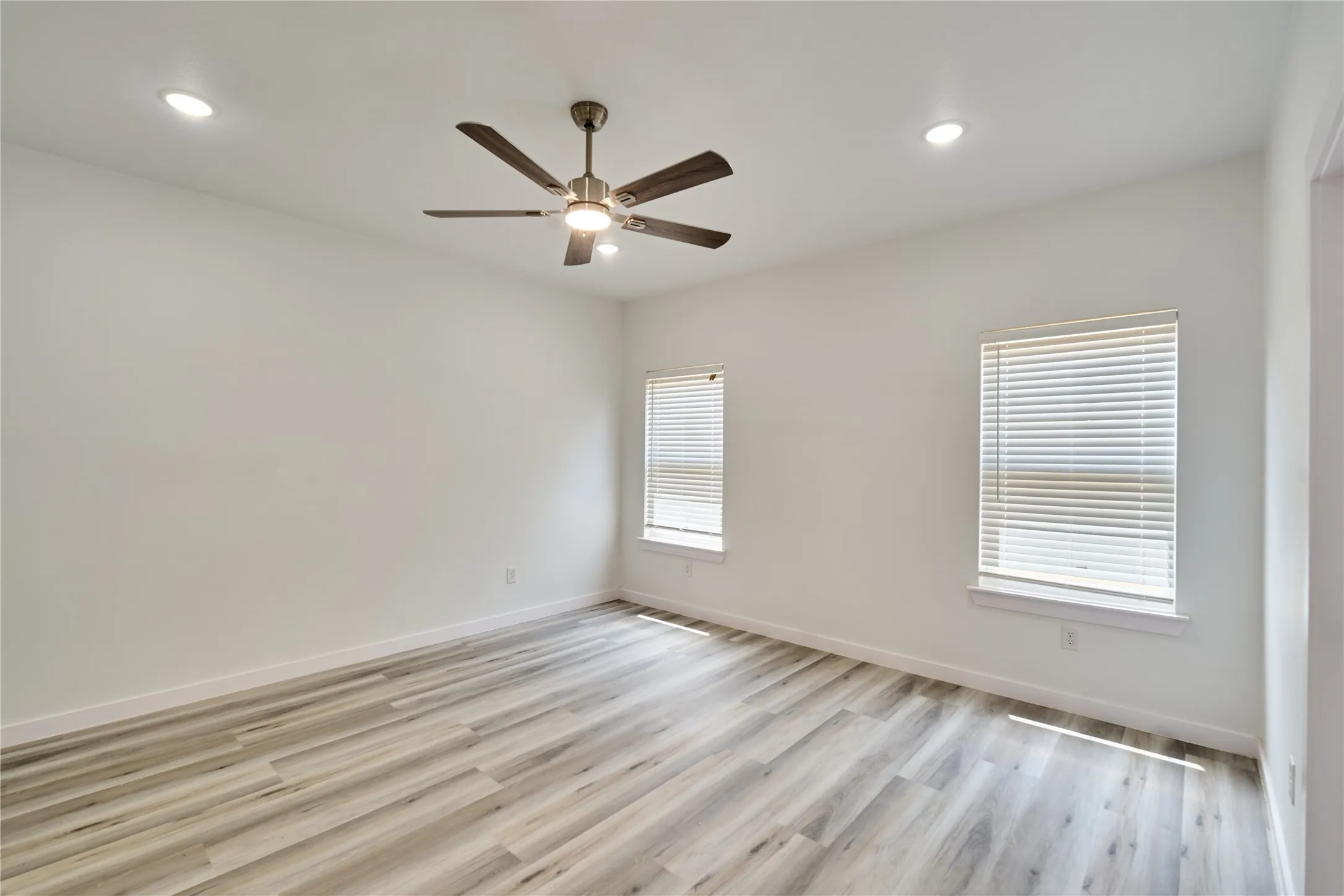 Interior room featuring light-toned wood-finish flooring