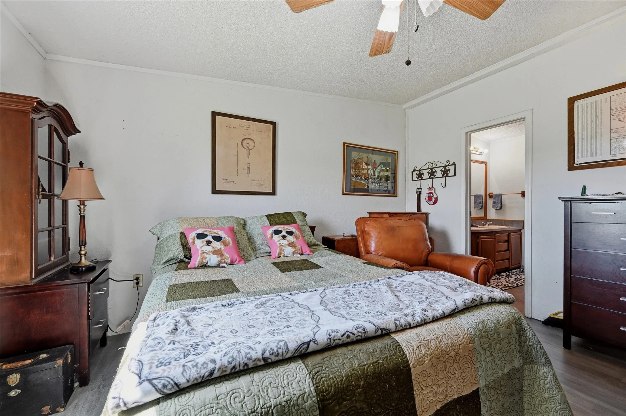 White walls frame a room featuring wood-finish flooring
