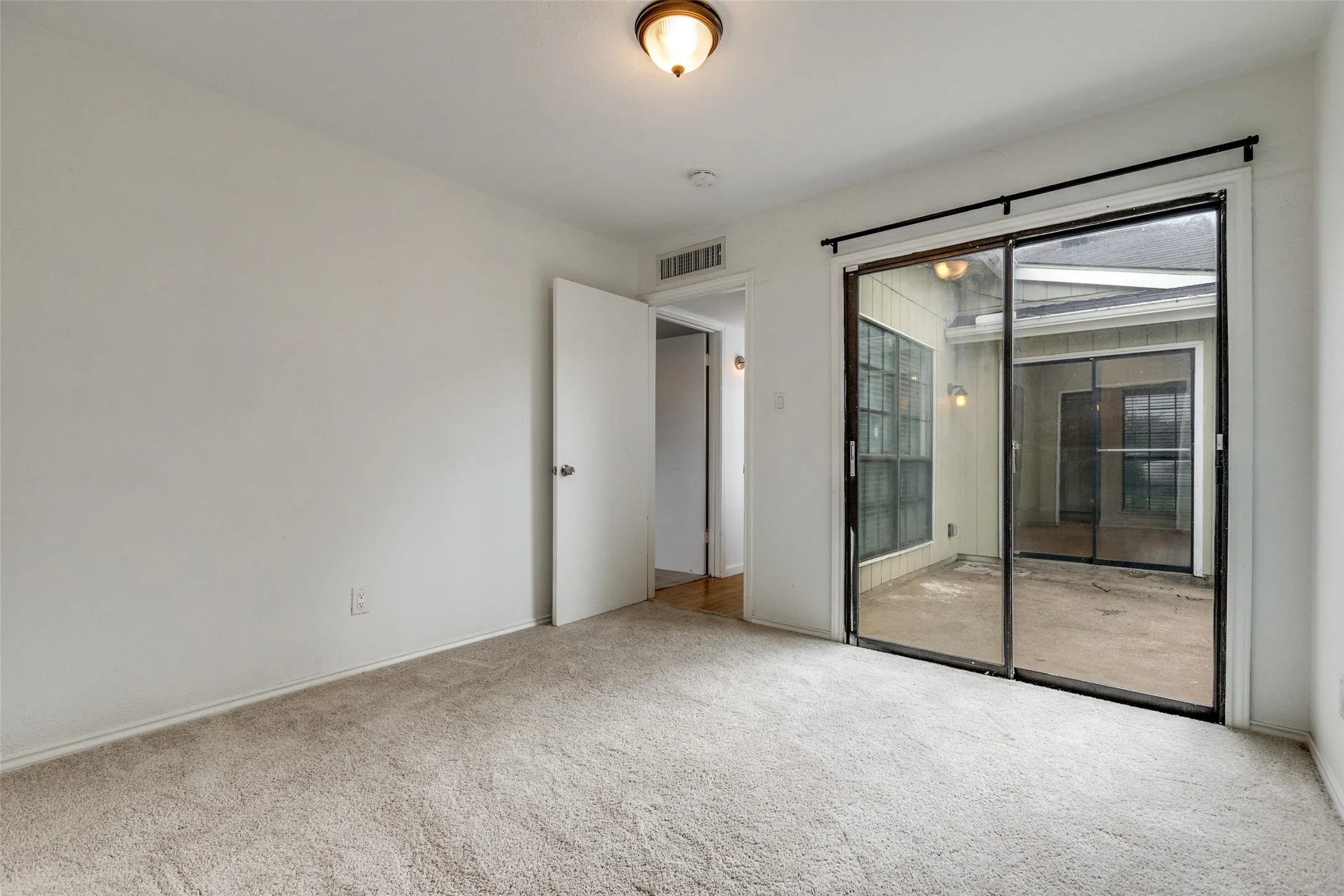 Bedroom w/ backyard patio access