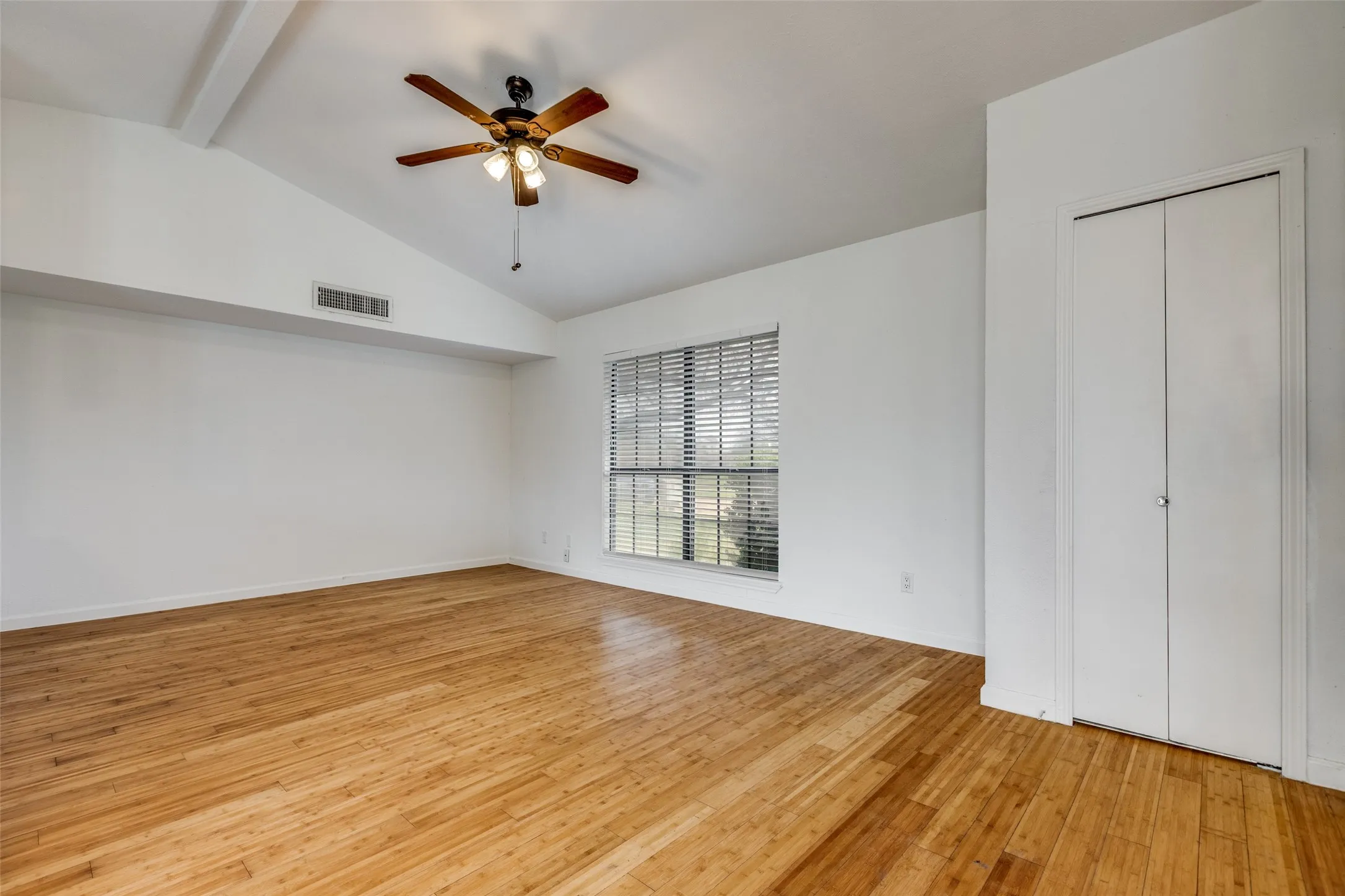 LR vaulted ceiling and closet w/ bamboo flooring