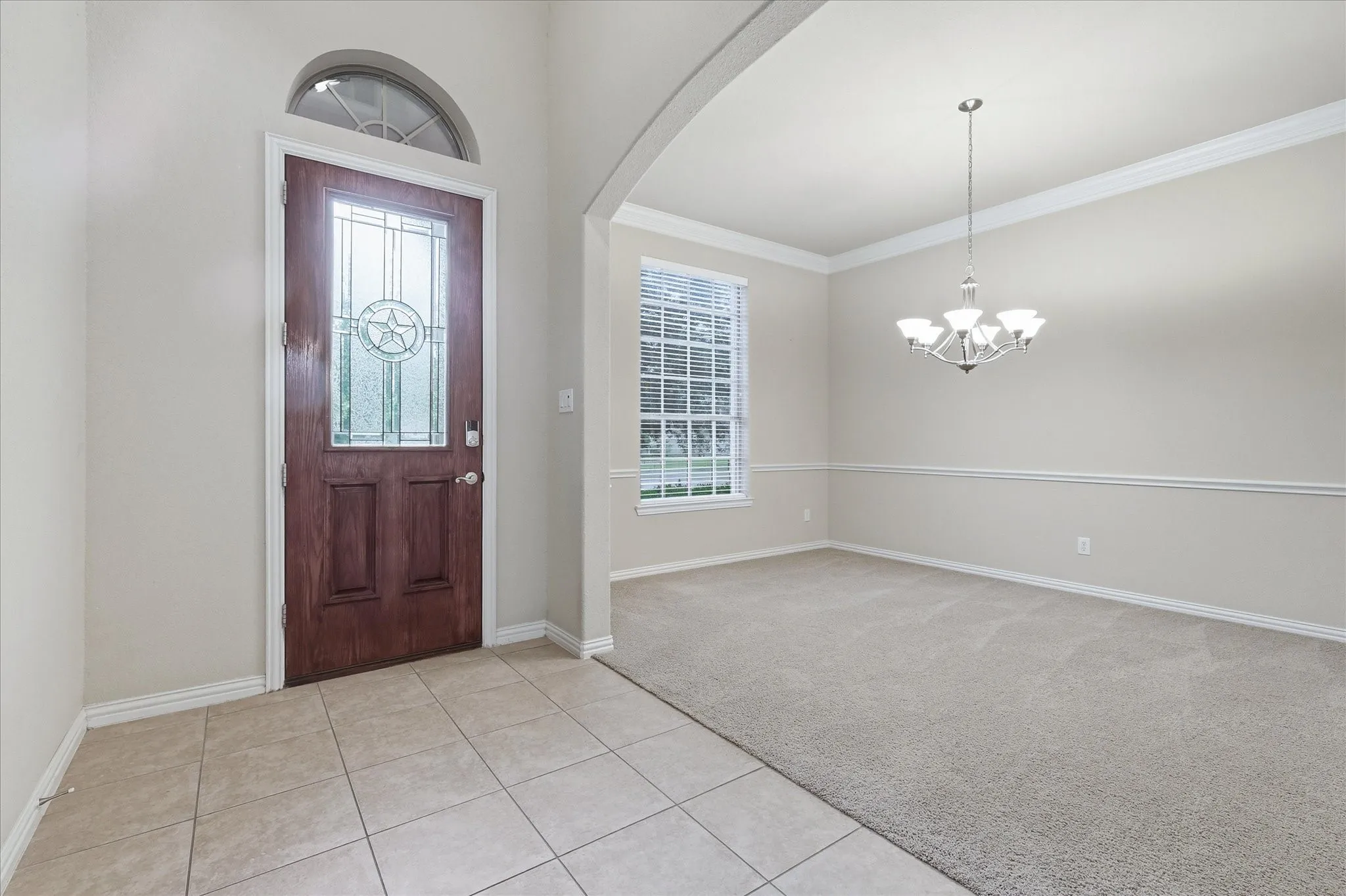 Entryway opens to the formal dining area. This space could easily serve as an office.