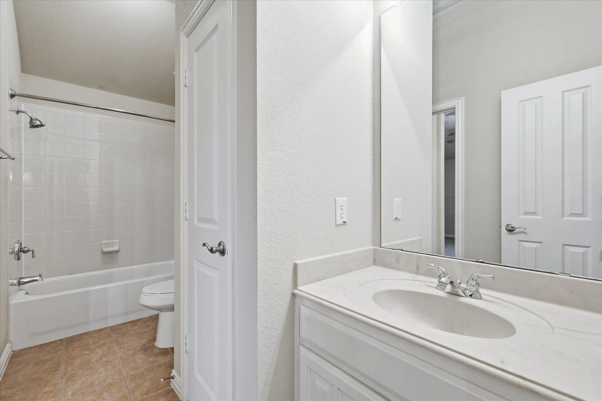 Second Jack-n-Jill bathroom with walk-in closets on both sides.