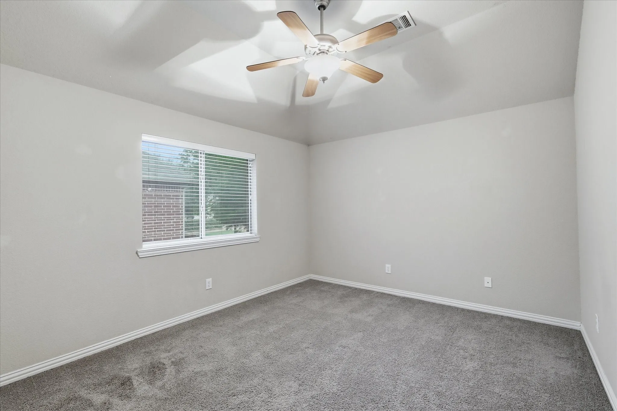 Spacious secondary bedroom with access to the second Jack-n-Jill bathroom.