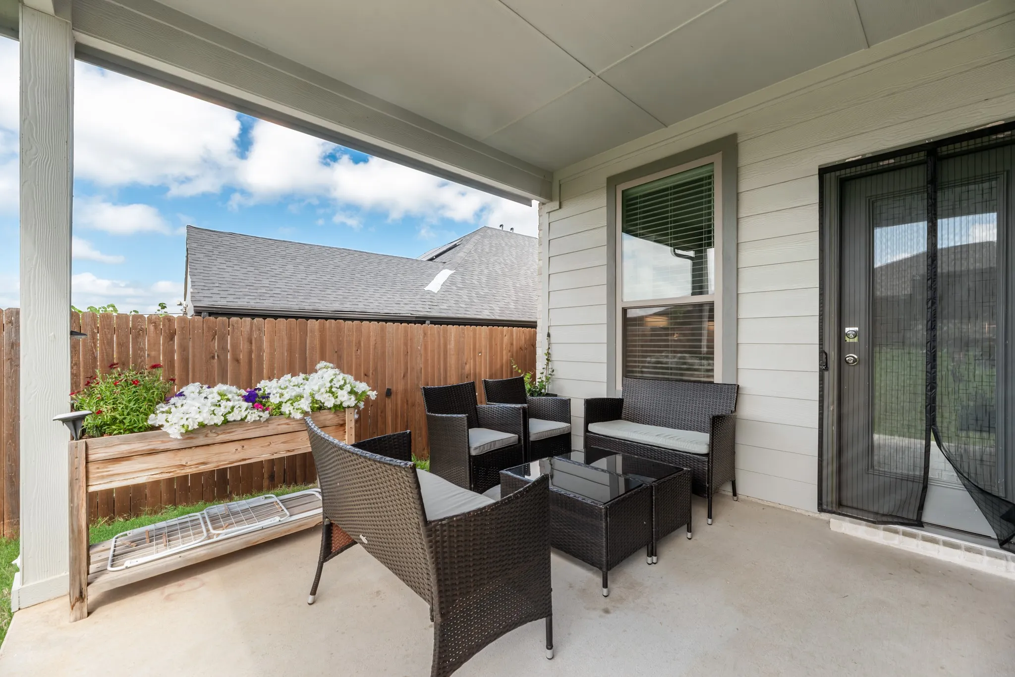 Covered outdoor patio with a concrete surface