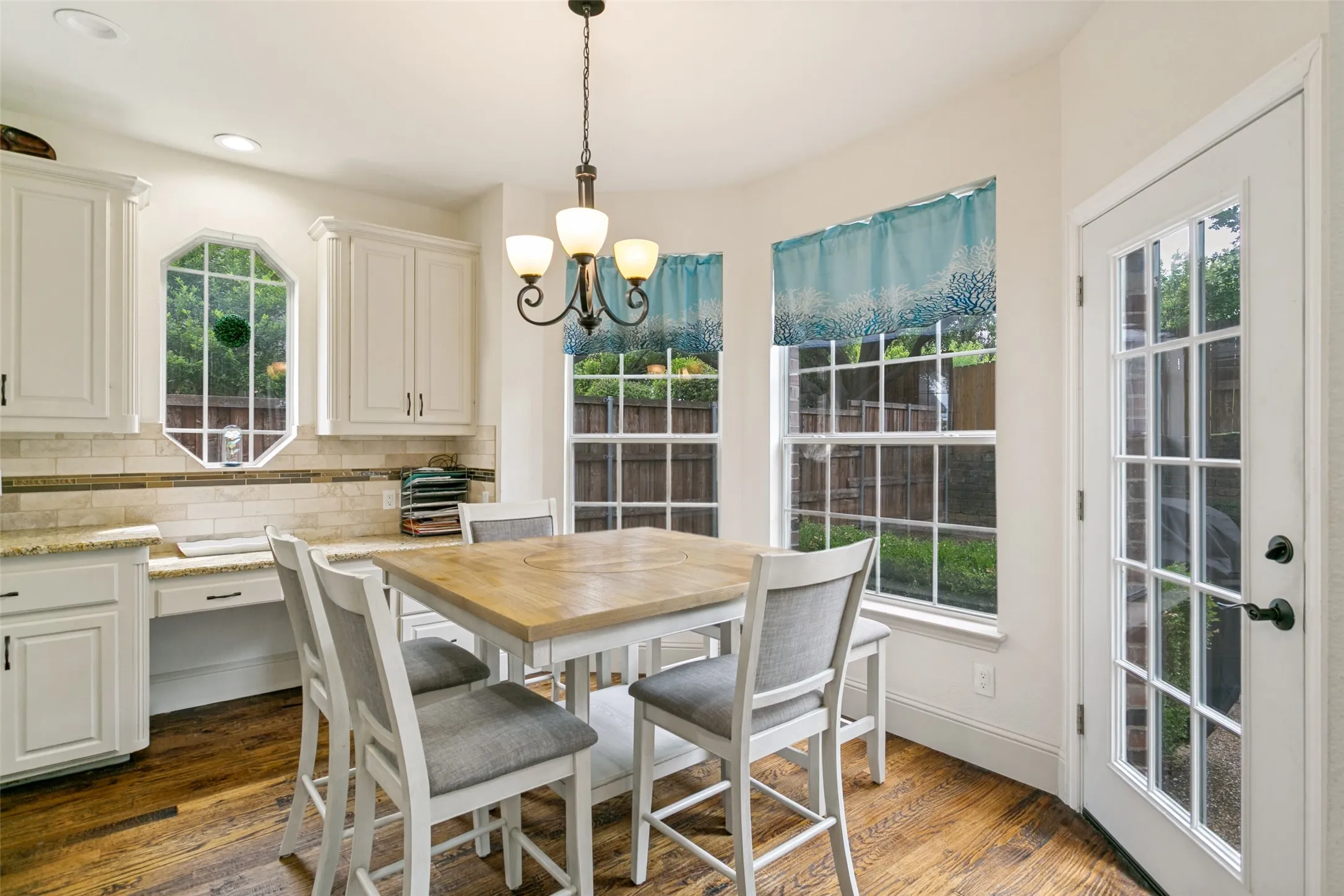 Kitchen dining area featuring a wood-finish table and seating