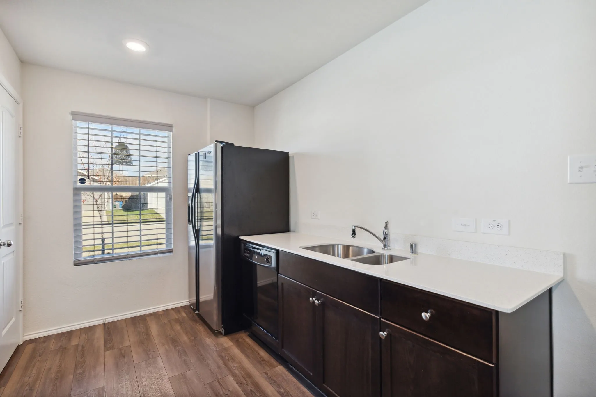 The other side of the kitchen has the sink and dishwasher.