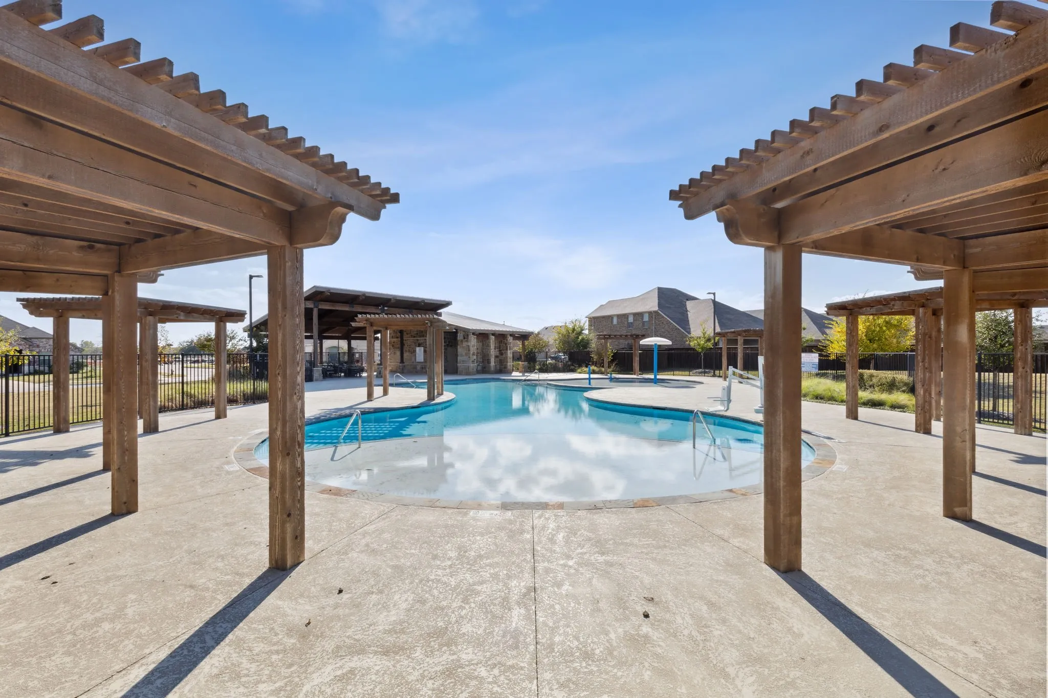 Neighborhood pool with shade cabanas