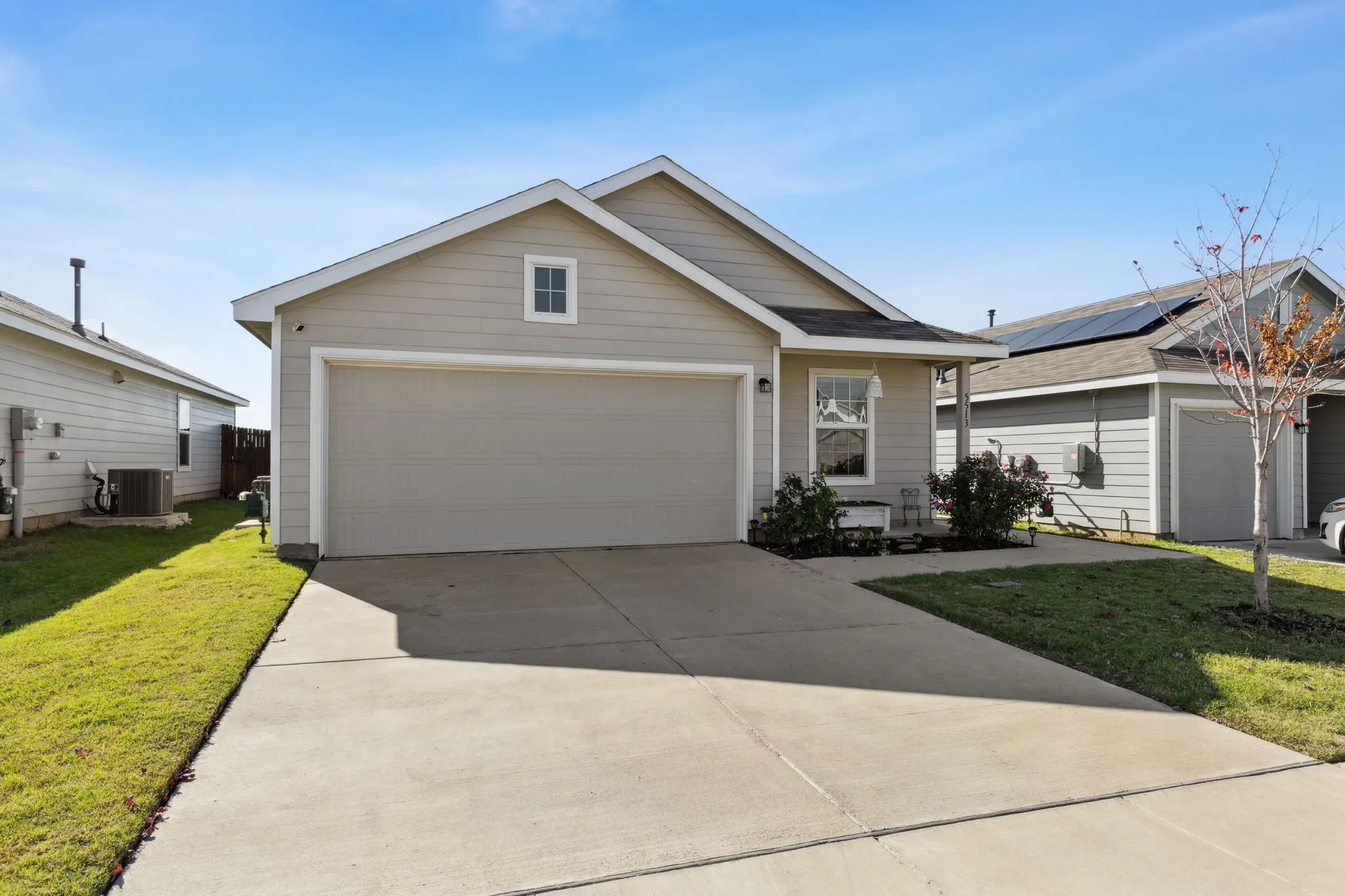 The driveway is perfect for extra cars or kids to play.