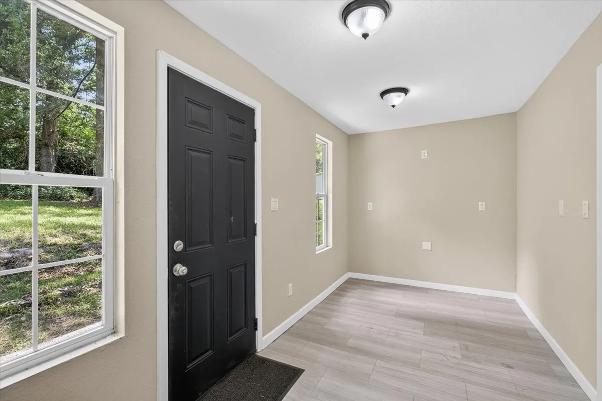flex room with lots of natural light, leads to laundry room