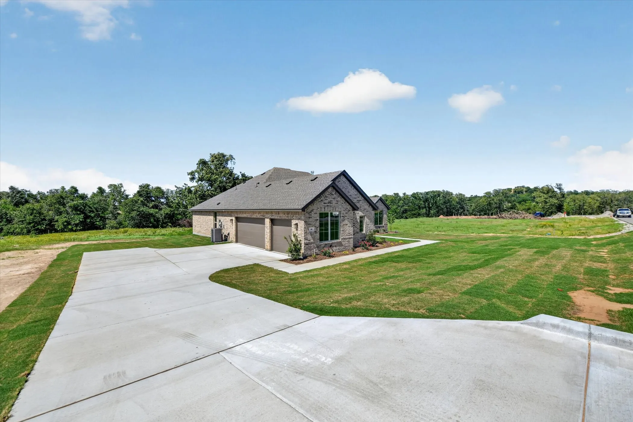Stone and brick exterior residence with a two-car garage