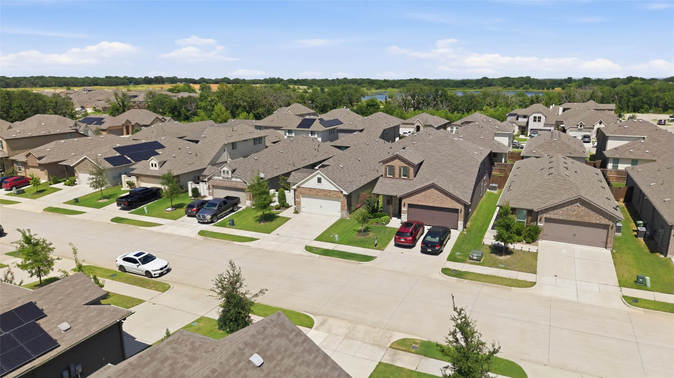 Aerial overview of a residential community featuring single-story and two-story homes