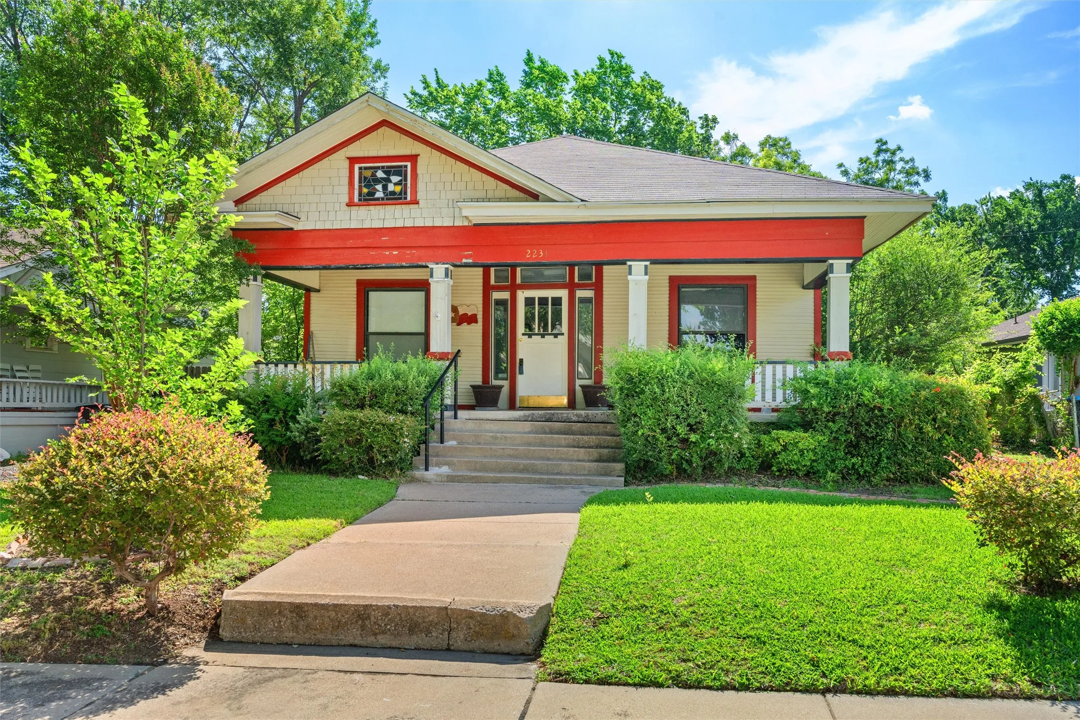 Craftsman-style residence featuring a prominent front porch with white columns
