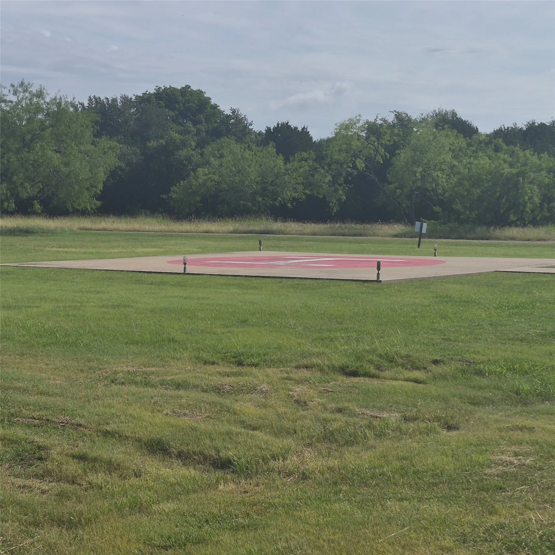 Helipad with concrete landing pad and painted surface markings