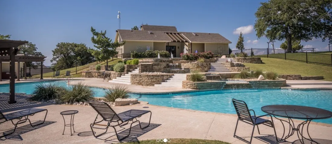 Resort-style pool area with multiple water features