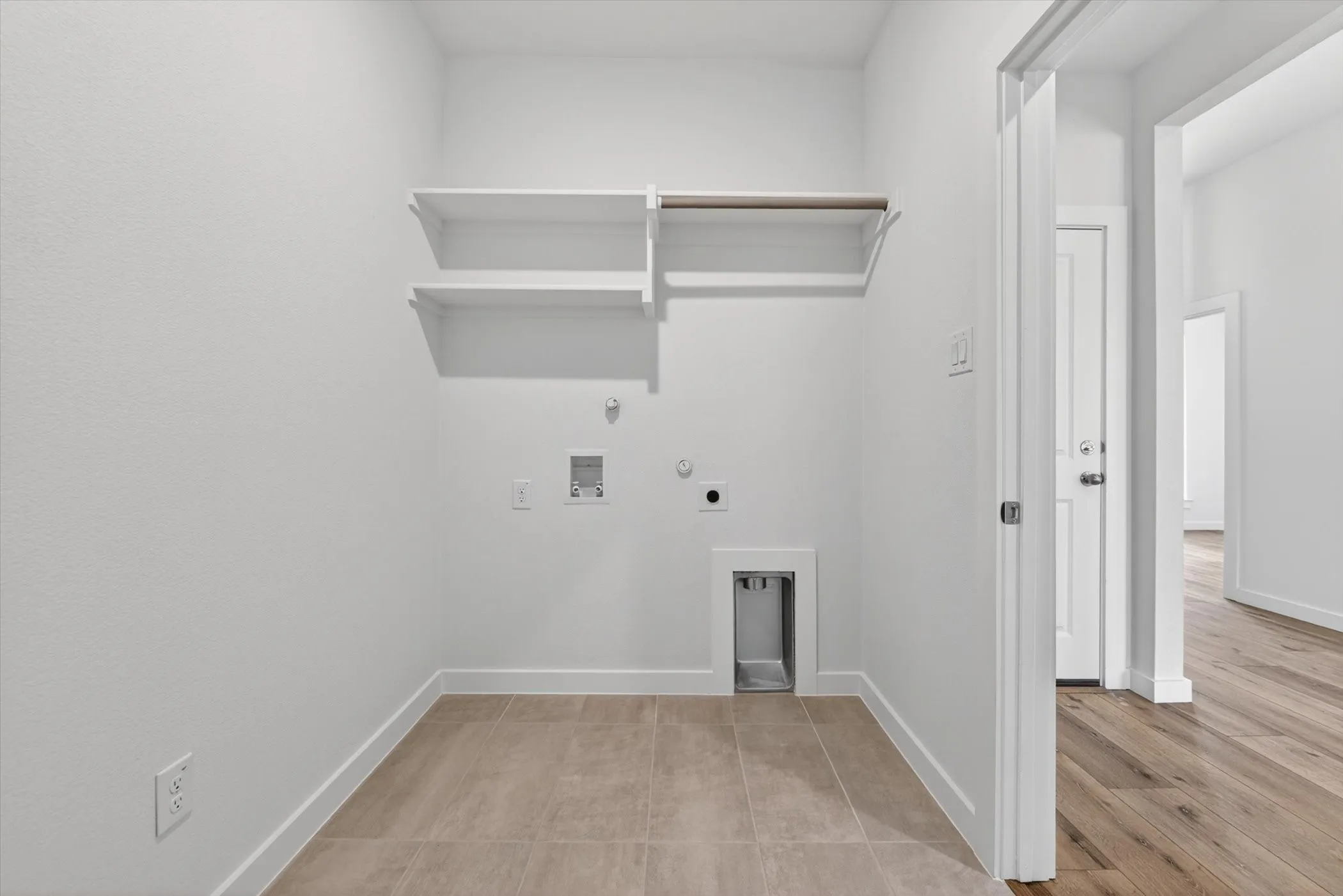 Open concept interior featuring wood-finish flooring throughout