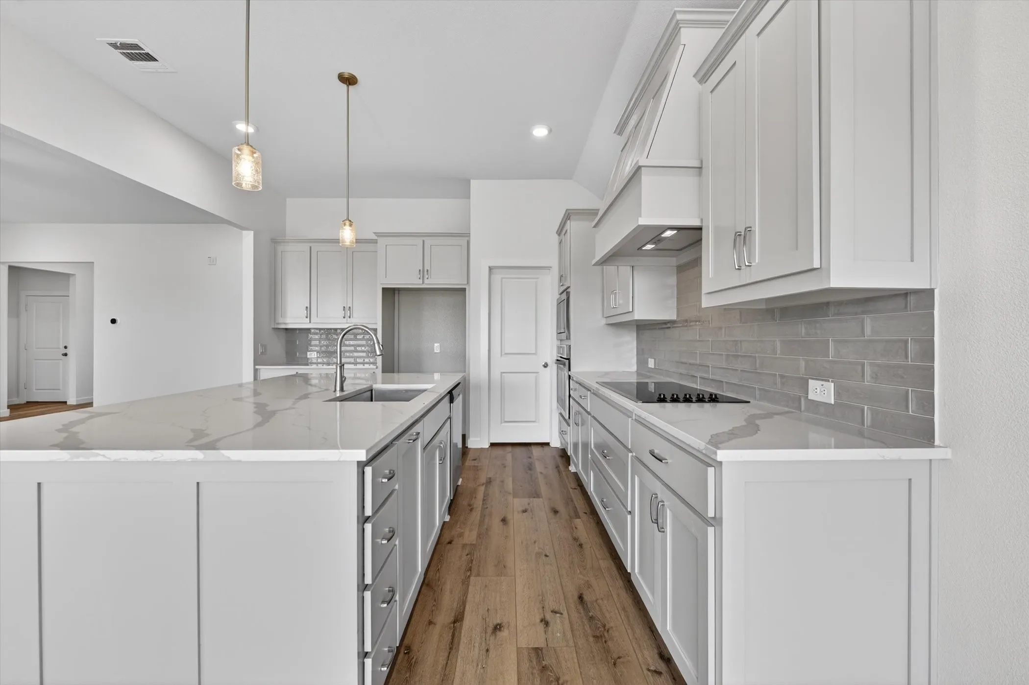 Dedicated laundry area featuring ceramic tile flooring and crisp white walls