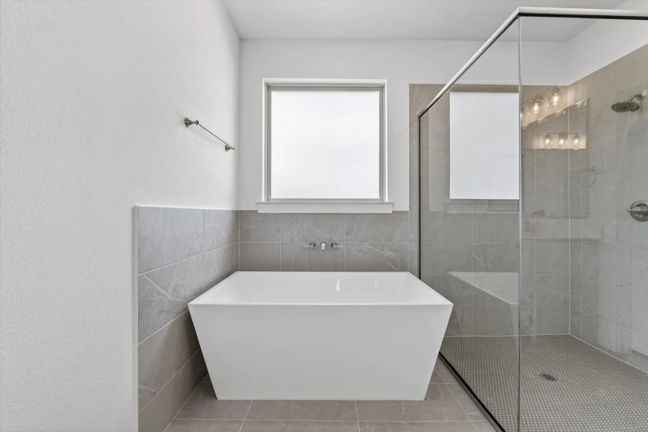 White wall finishes, recessed lighting, wood-finish shelving, built-in dresser with six drawers, and a solid core door