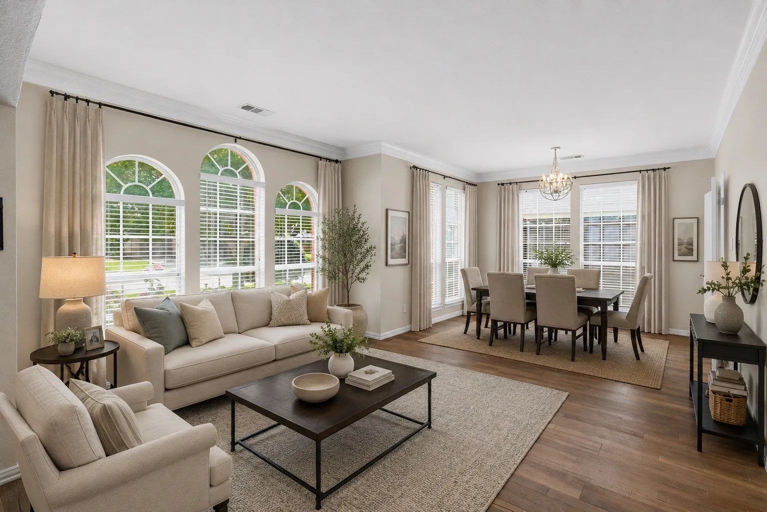 Open concept living area featuring wood-finish flooring