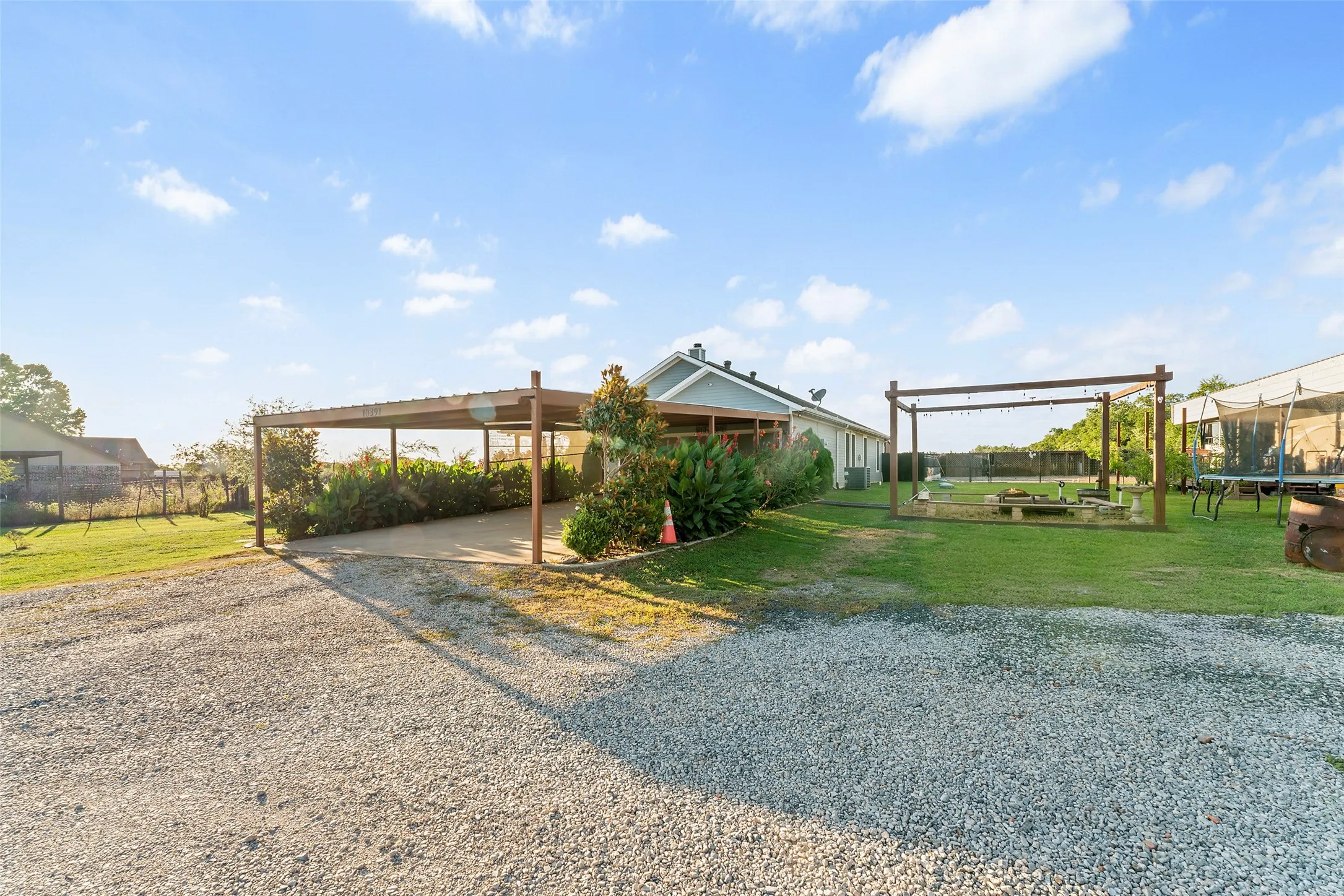 Outside pergola and fire pit