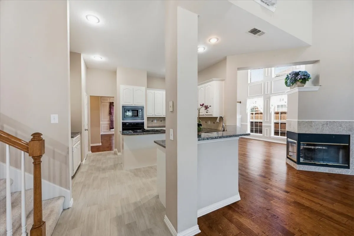 DISPLAY OF OPEN CONCEPT - FAMILY ROOM, KITCHEN AND OFFICE OR 2ND LIVING AREA - HIGH CEILINGS - BACK STAIRS - OPENING TO FORMAL DINING