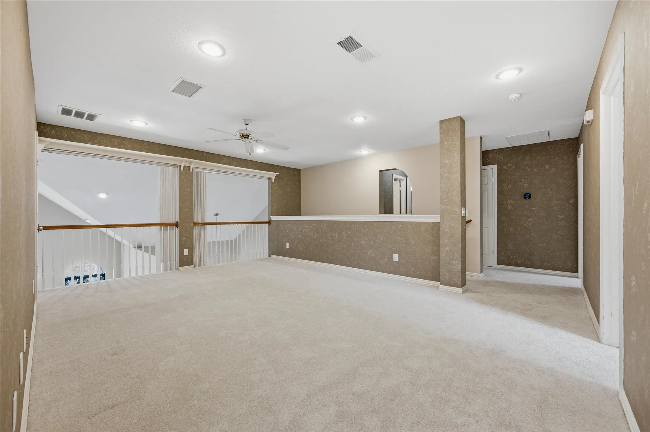 large multipurpose game room, media room - blinds can close to the room below - corner closet  - 2nd stairway behind the half wall