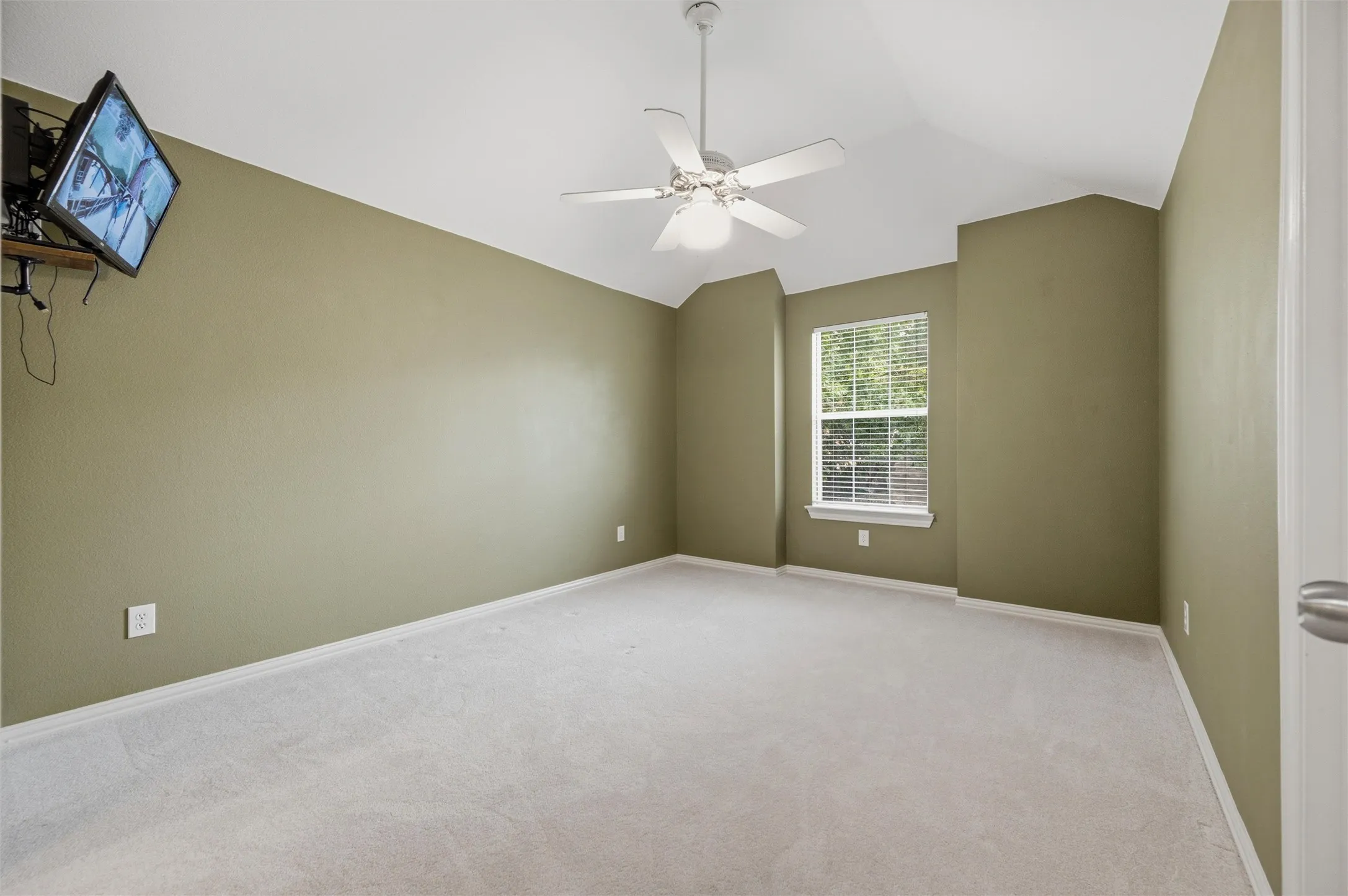 2nd floor bedroom with mounted TV and camera to outside - walk in closet - view front street JACK N JILL BATH