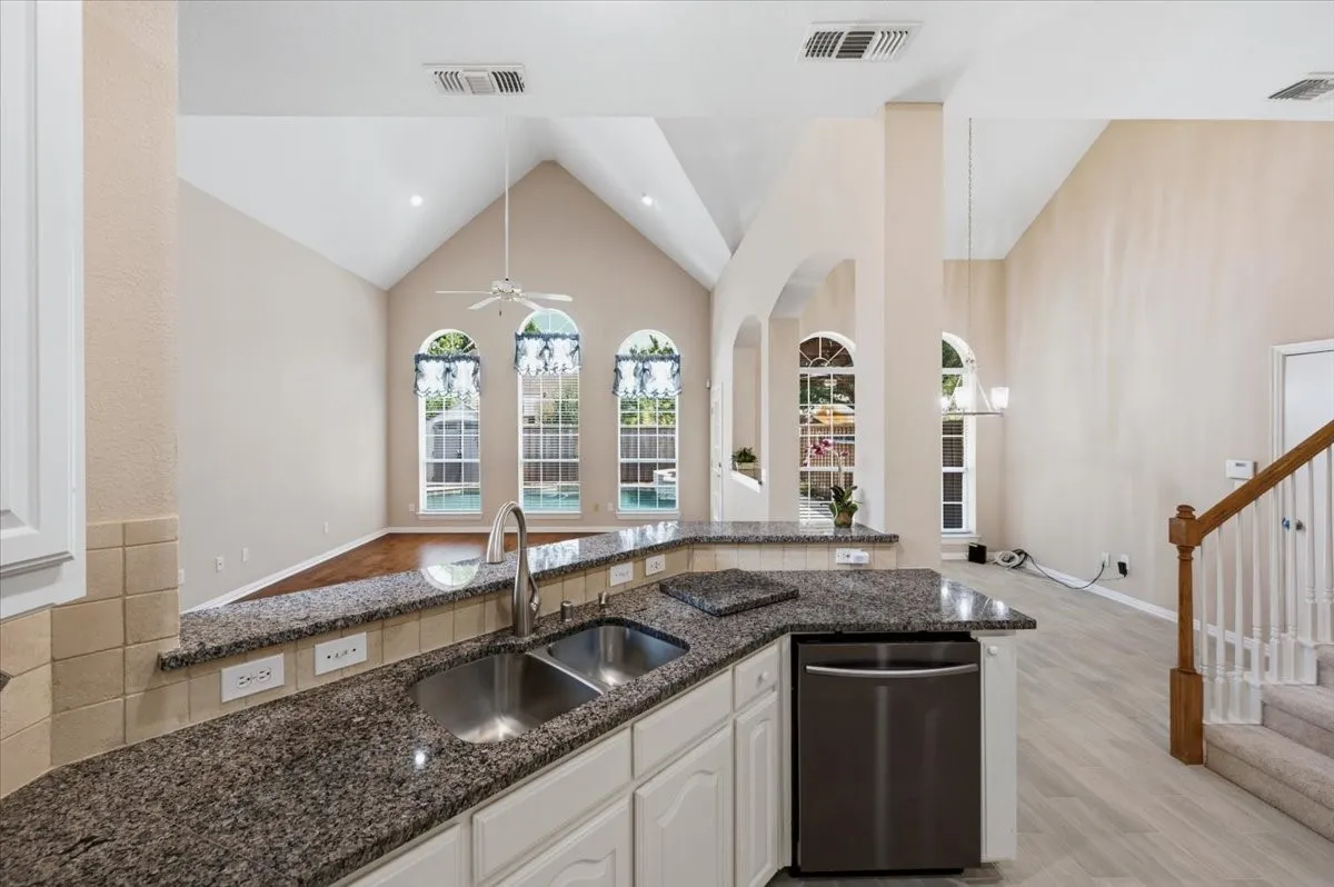 High ceilings in Family room and breakfast area - back stairs to the 2nd floor - granite and tumbled marble backsplash - stainless double sink