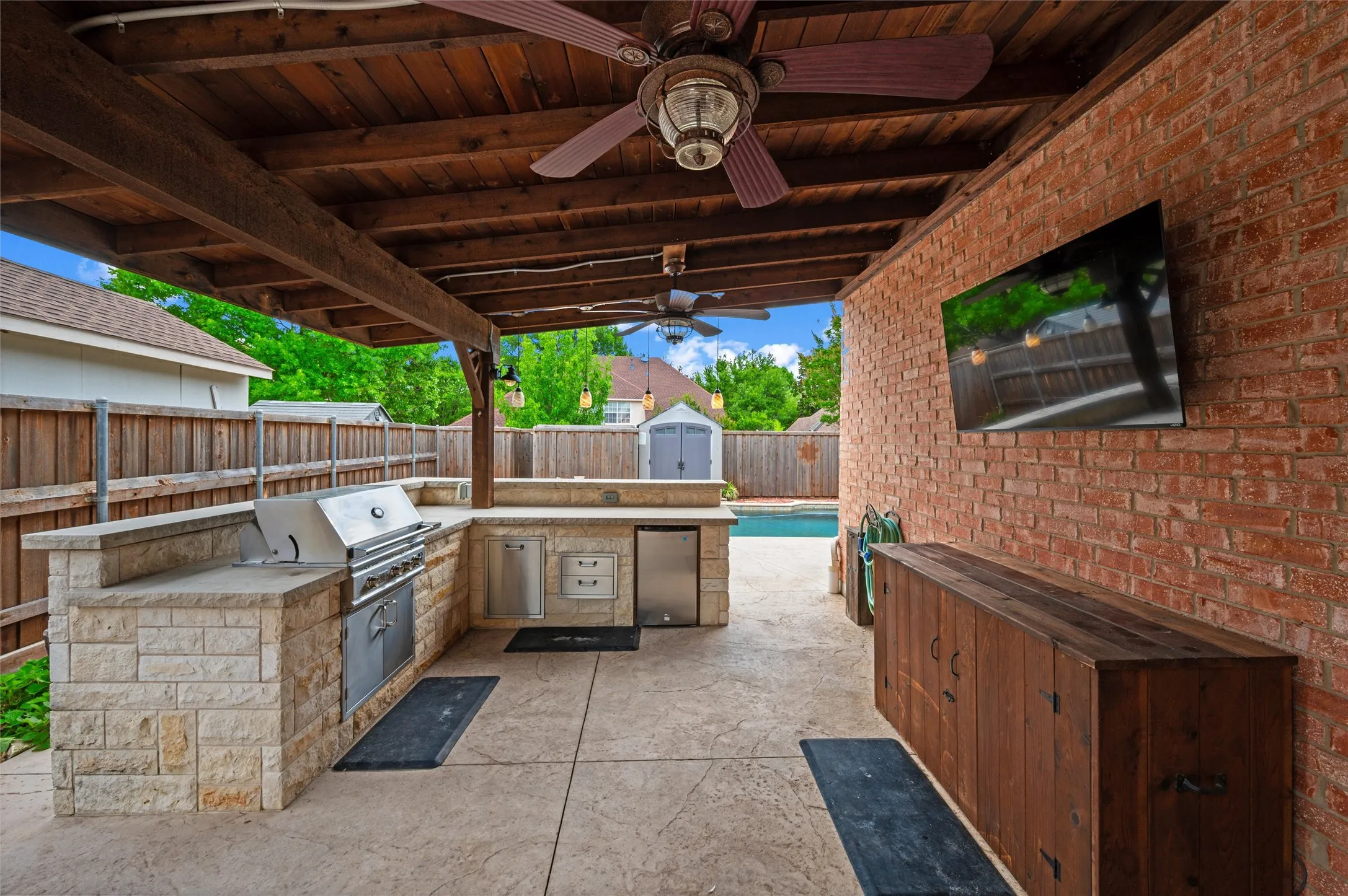 Fabulous OutDoor Kitchen with Gas Grill, refrigerator, TV, storage  2 ceiling fans