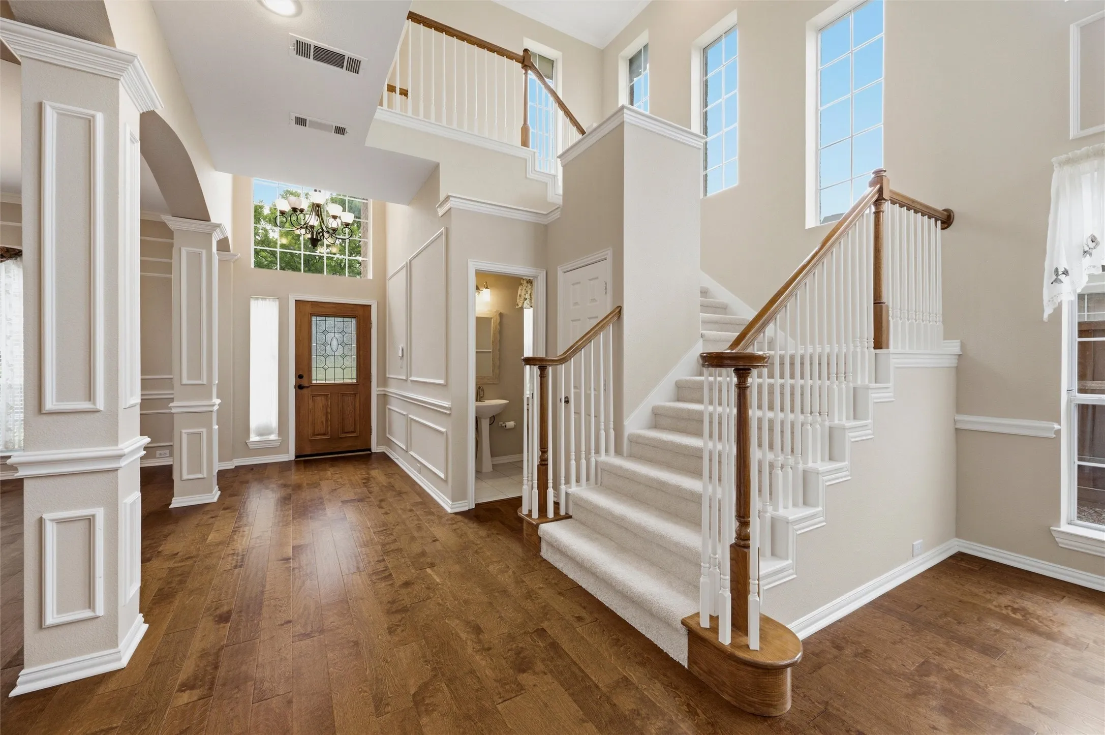 Large Entry Hall with steps to second floor - beautiful flooring - Two Story ceilings