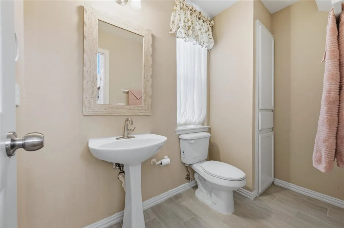 HALF BATH FOR GUESTS - FIRST FLOOR NEAR ENTRY - HUGE WALK IN CLOSET UNDER THE STAIRS