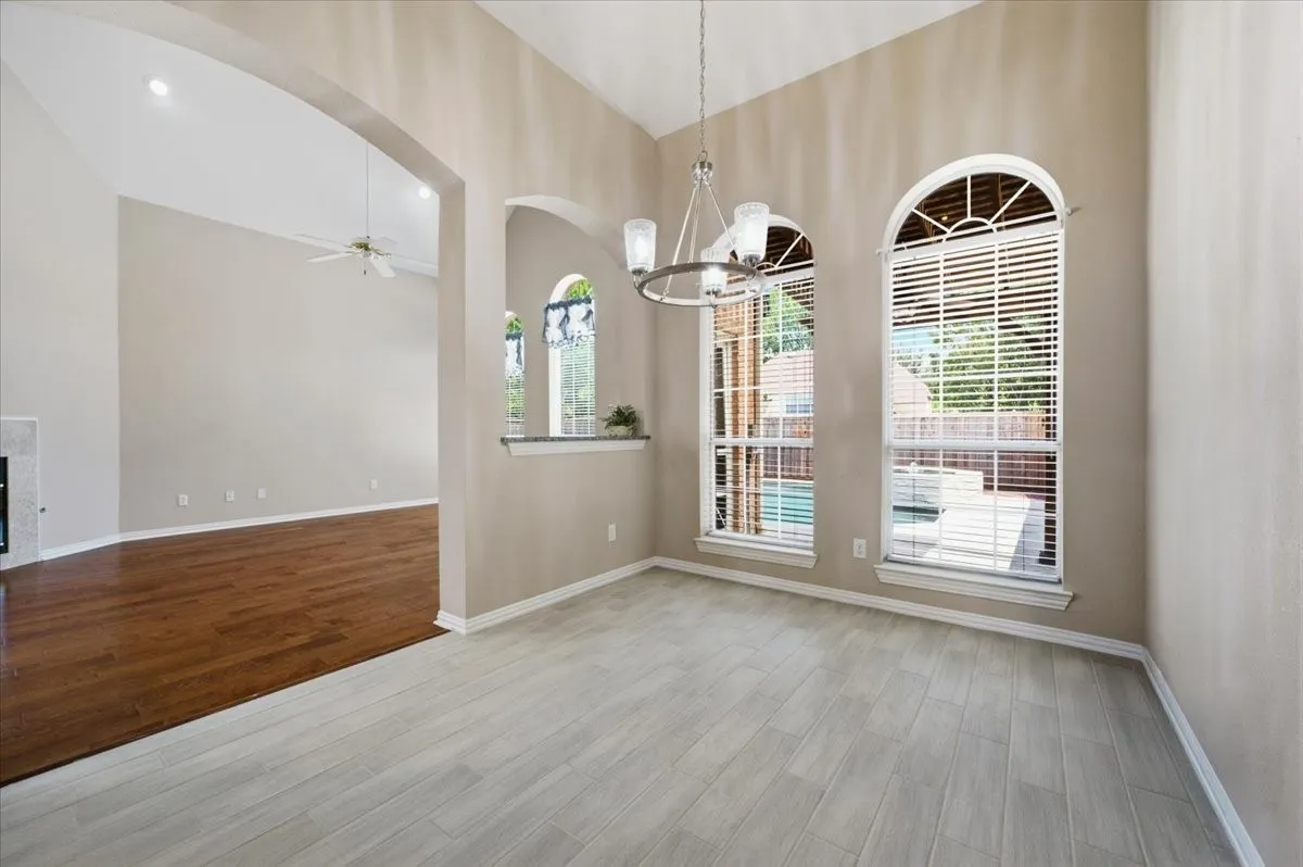 OPEN TO KITCHEN - FAMILY ROOM - NEW TILE FLOORING IN THE KITCHEN - DOOR TO THE FRESHLY PAINTED GARAGE AND DOOR TO THE 2ND COVERED PATIO  - BRIGHT AND CHEERFUL