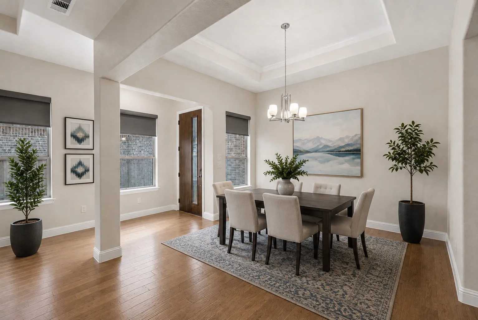 Formal dining room offers flexibility for entertaining or everyday meals and overlooks the front entry. Enjoy this virtually staged room for furniture placement ideas.