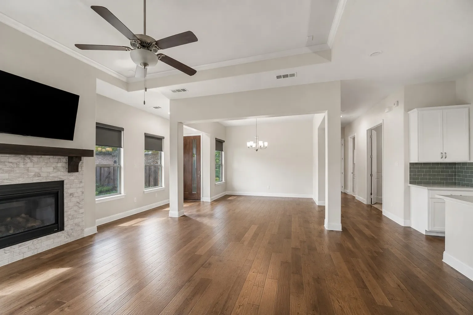 Inviting living area opens effortlessly to the dining room, creating an ideal space for gatherings.