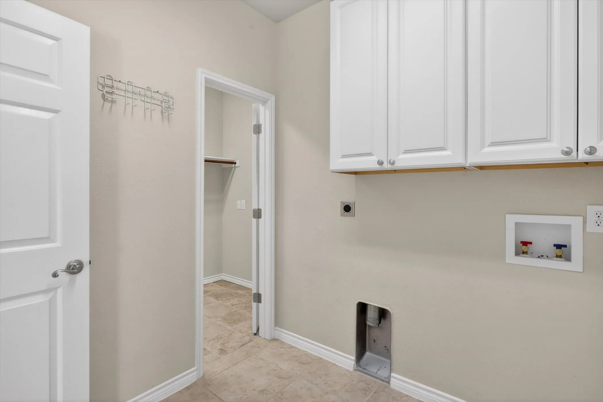 laundry room connected to primary suite closet