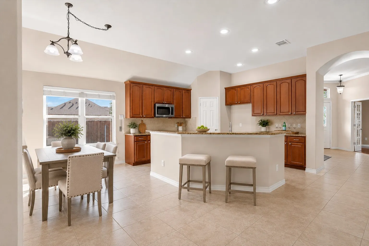 Light Bright open kitchen and breakfast nook open to the living room