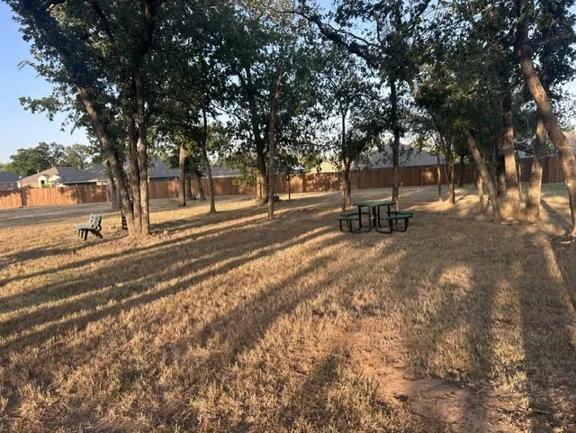 Small park with tables and benches 1 block from your home.