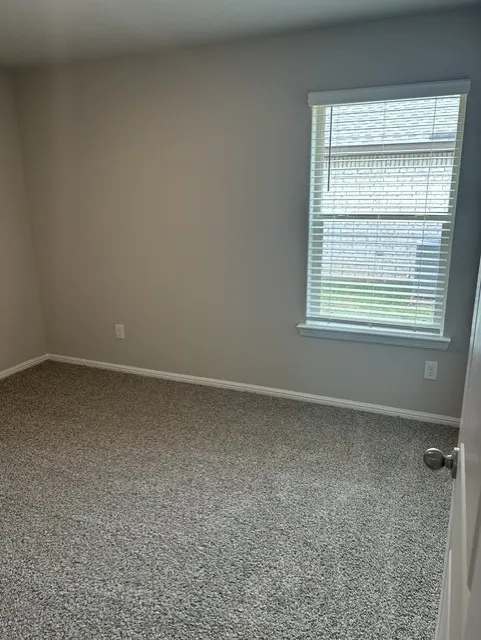 Bedroom #2 with ceiling fan and walk-in closet.