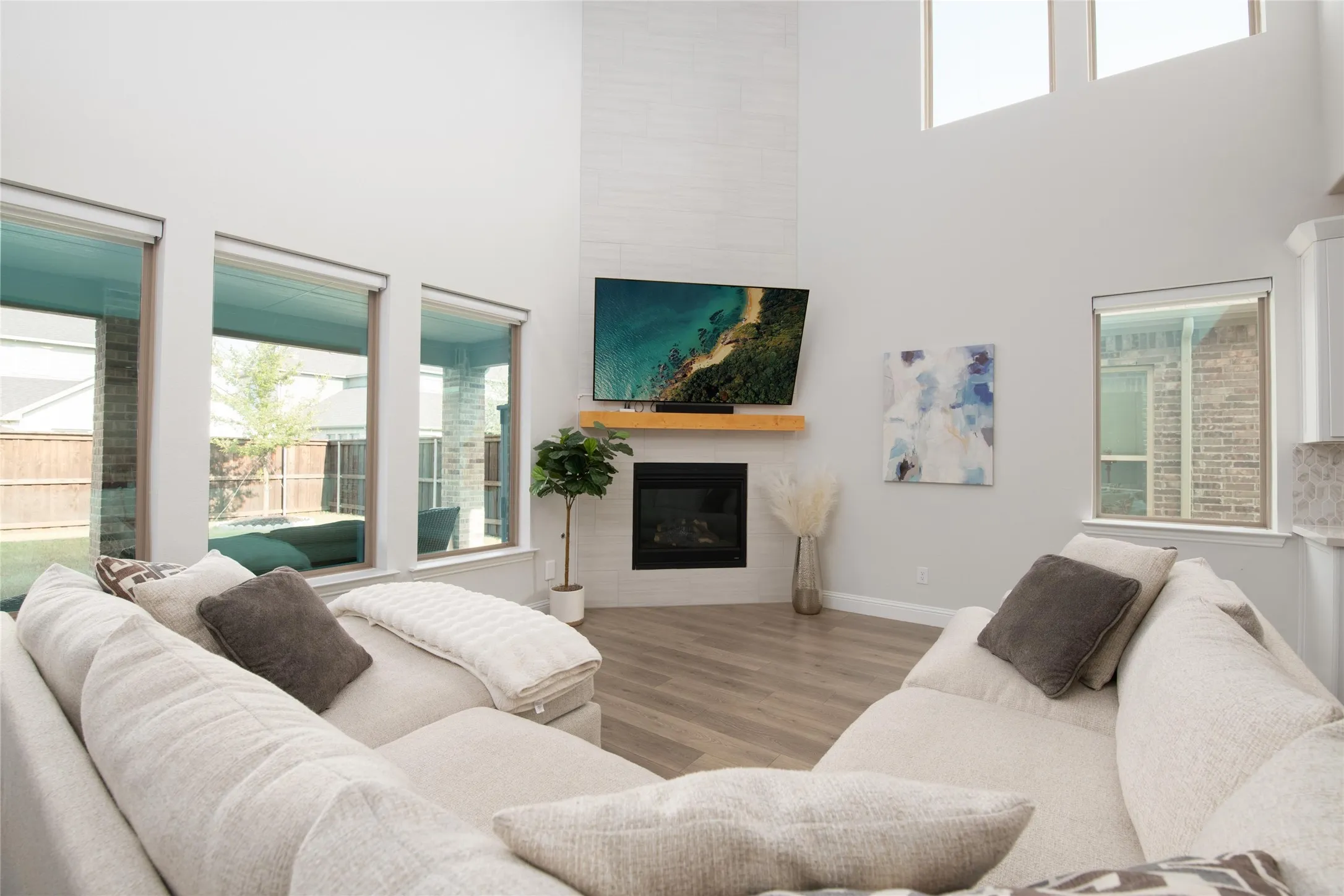 Filled with natural light from a wall of windows, the spacious gathering room offers the perfect setting for relaxing evenings and everyday living.