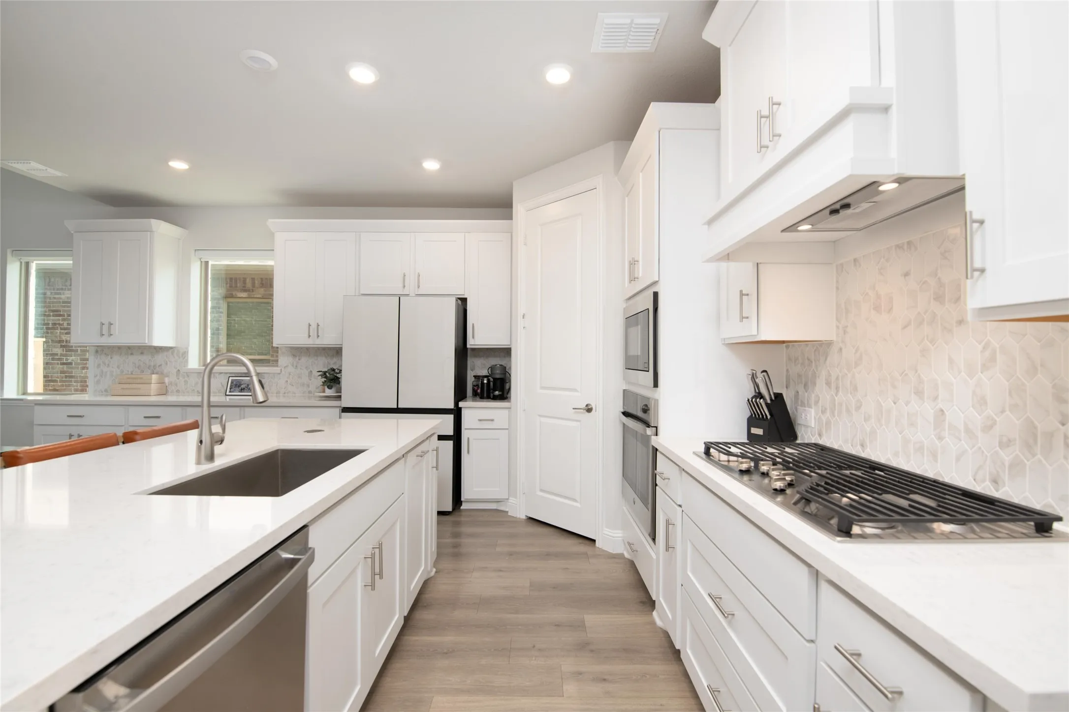 Thoughtful design and premium finishes come together with upgraded cabinetry, quartz countertops, and an open-concept layout that keeps everyone connected.