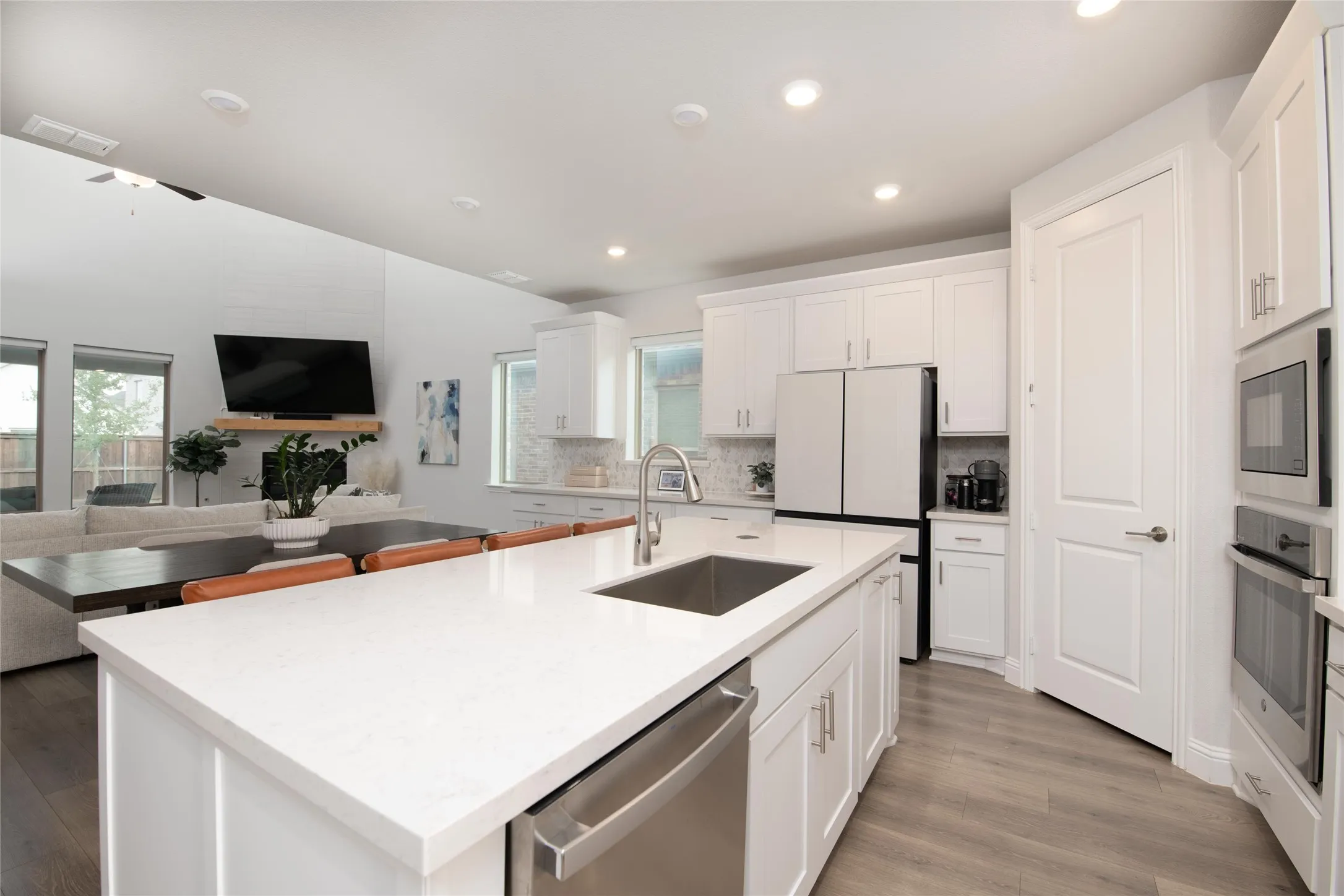 At the heart of the home, the gourmet kitchen seamlessly connects to the dining area and gathering room, creating an ideal space for everyday living and effortless entertaining.