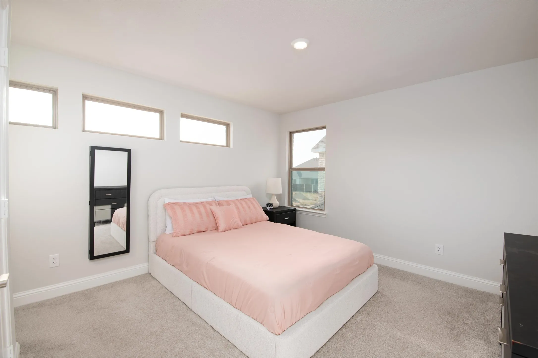 Perfect for guests, teens, or extended family, this spacious secondary bedroom enjoys the rare luxury of its own private ensuite bath, offering comfort, privacy, and convenience.