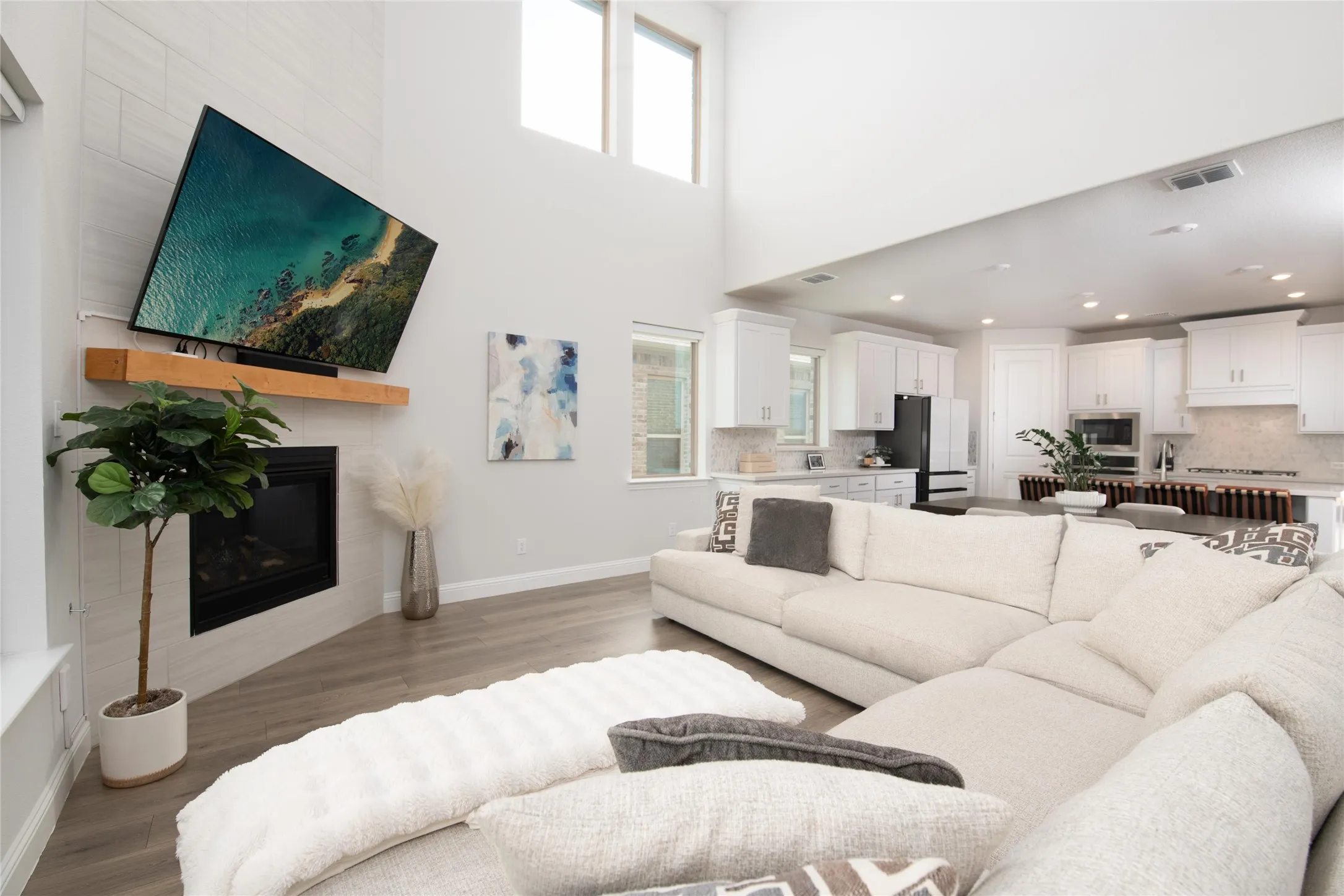 Open to the kitchen and dining area, the gathering room keeps family and guests connected while providing ample space for entertaining on any scale.