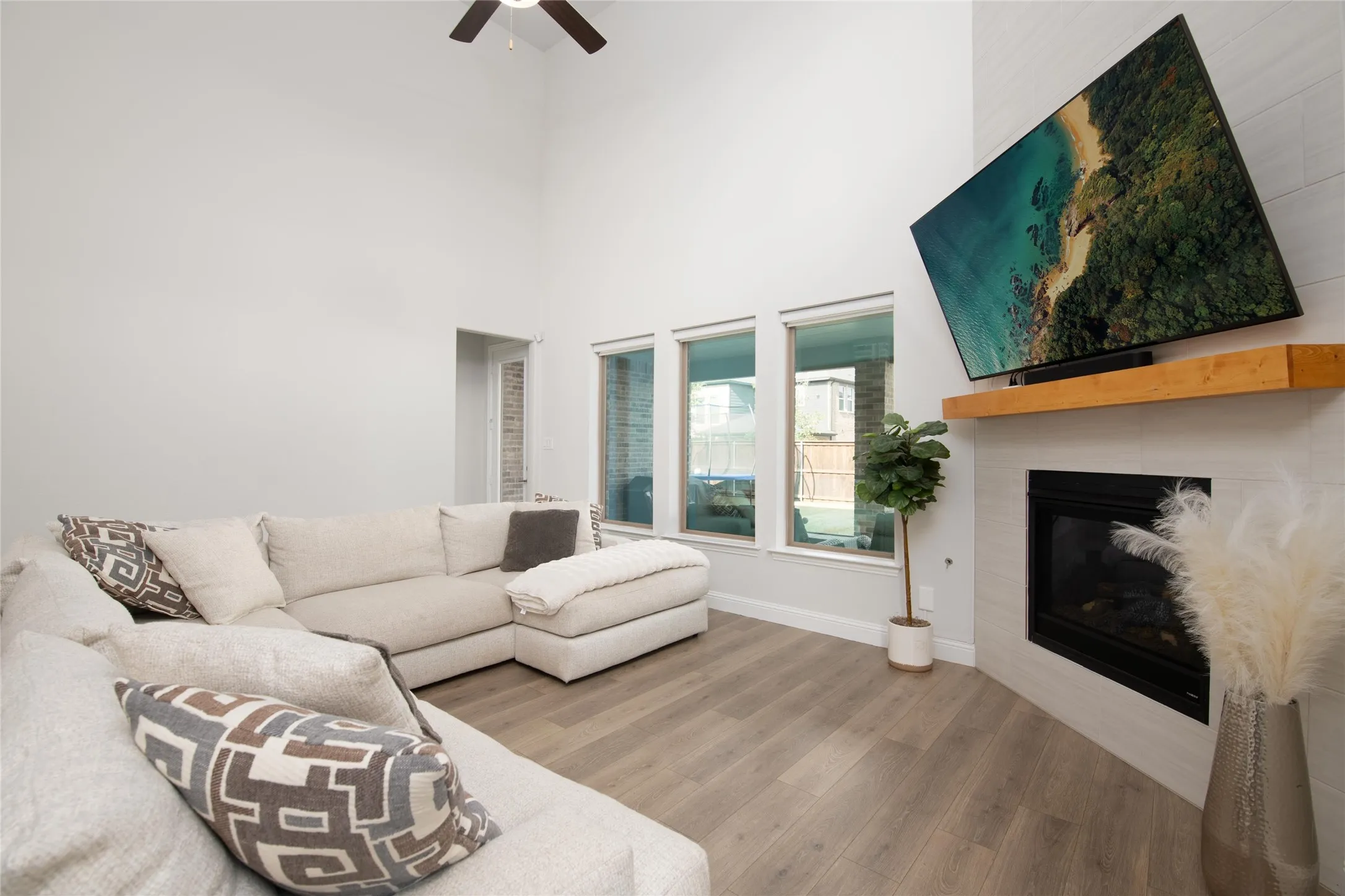 A gas log fireplace creates a warm focal point, adding comfort and character to this inviting living space.