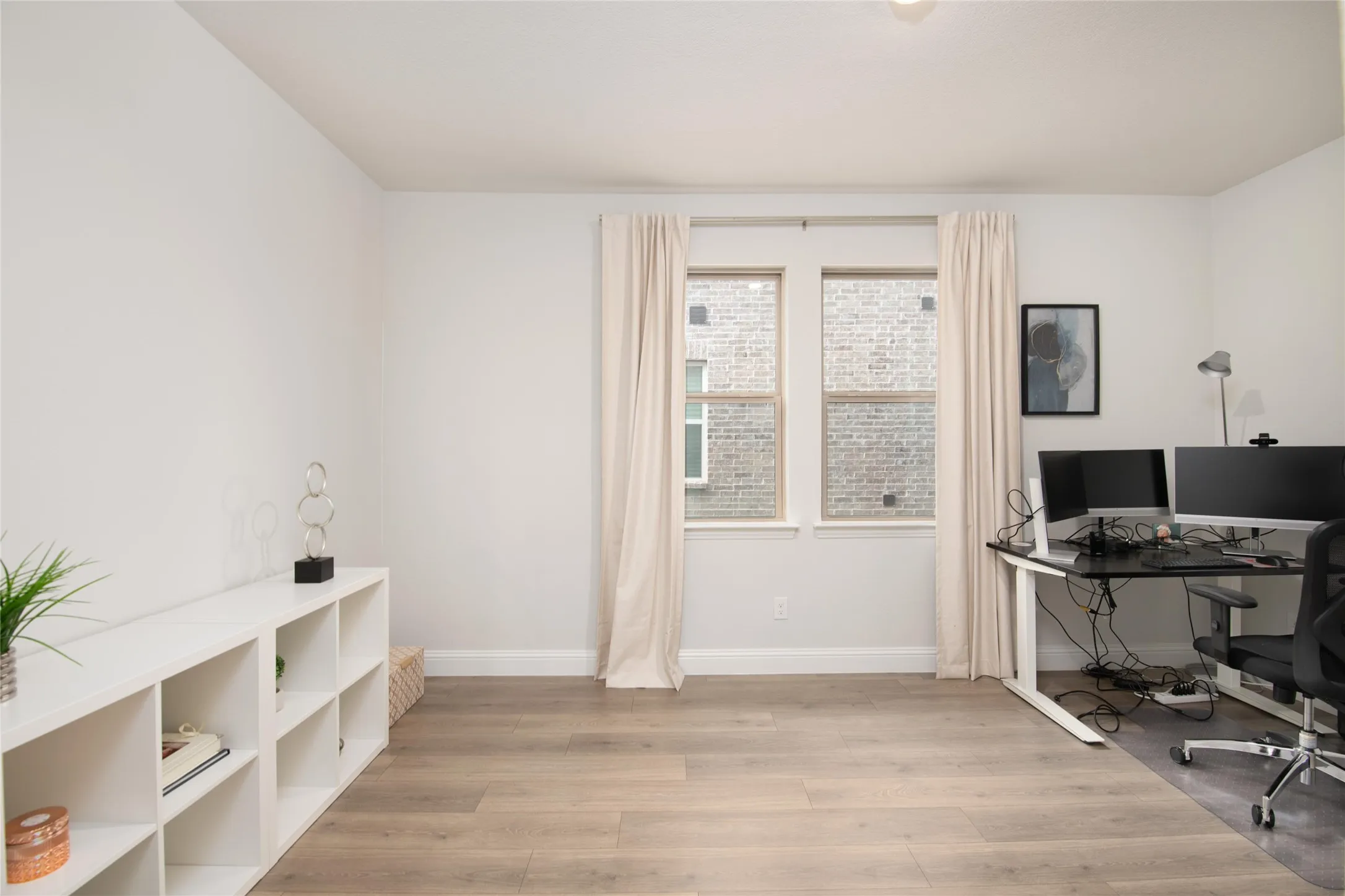 Featuring solid French doors and a private location within the home, this versatile space is ideal for a home office, study area, hobby room, or library.