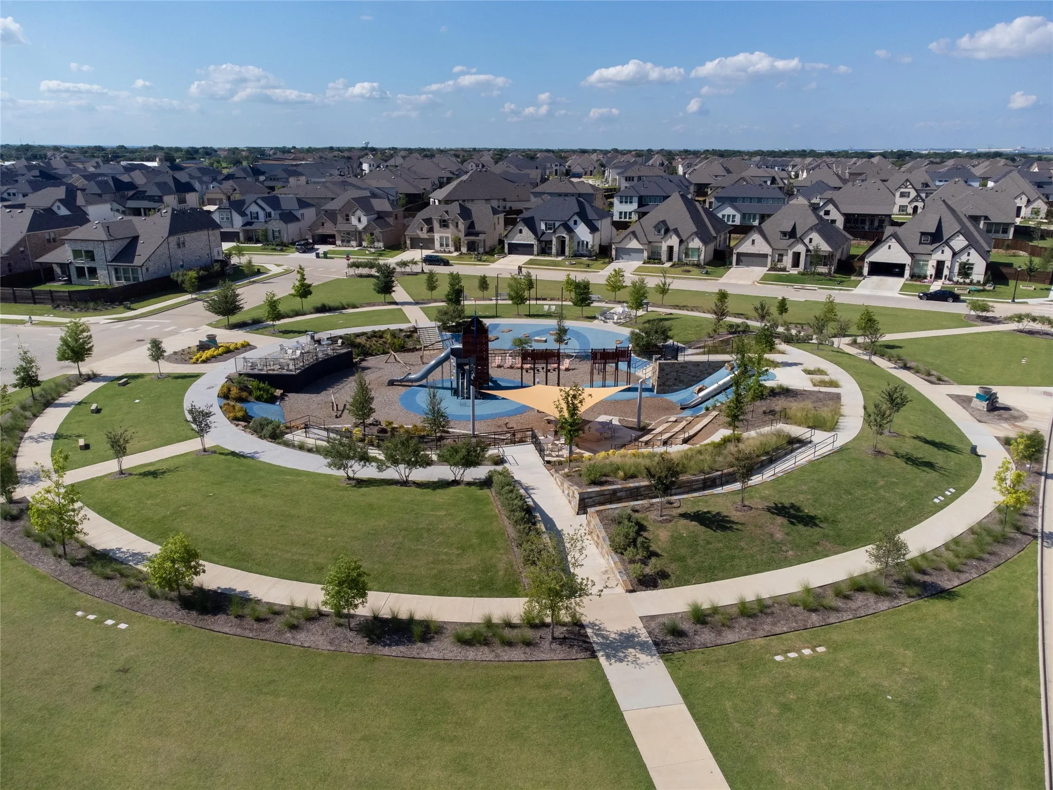 Designed for outdoor fun and neighborhood connection, the community playground features multiple play structures, climbing elements, shaded gathering areas, and wide open green spaces perfect for play, recreation, and community events.
