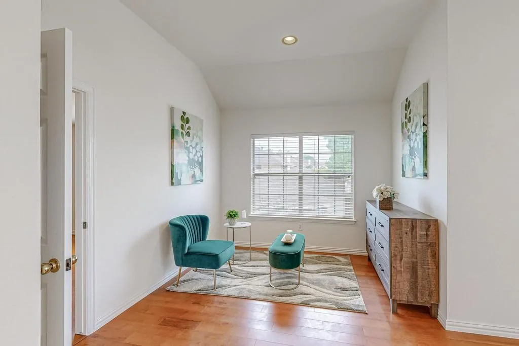 Vaulted ceilings complement the natural light from the large window