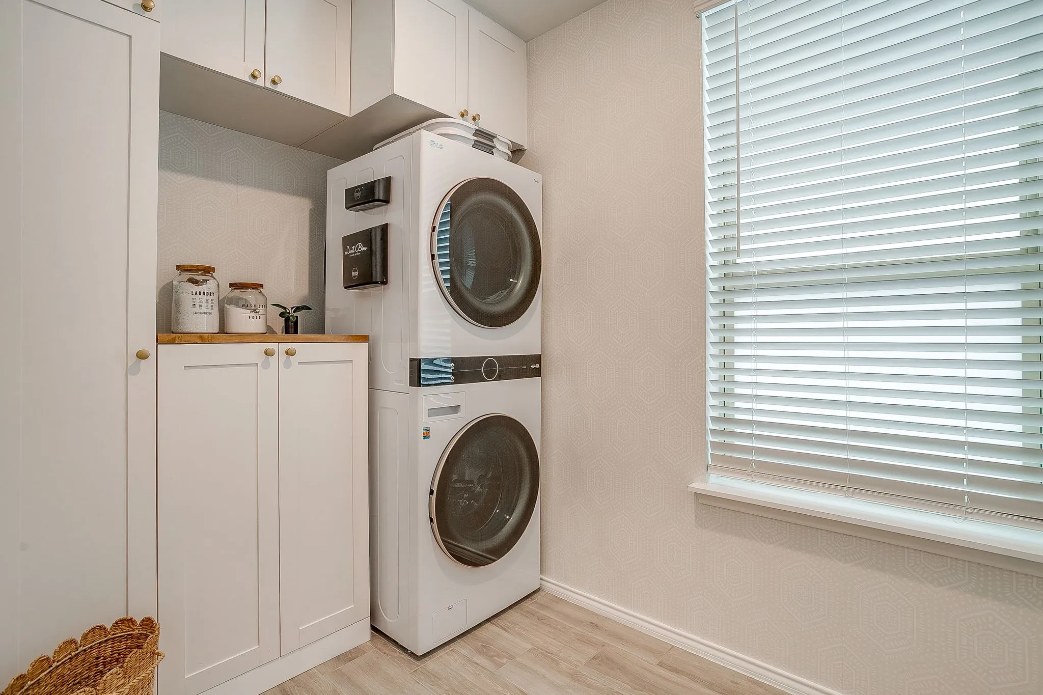 Spacious utility room with custom built storage.