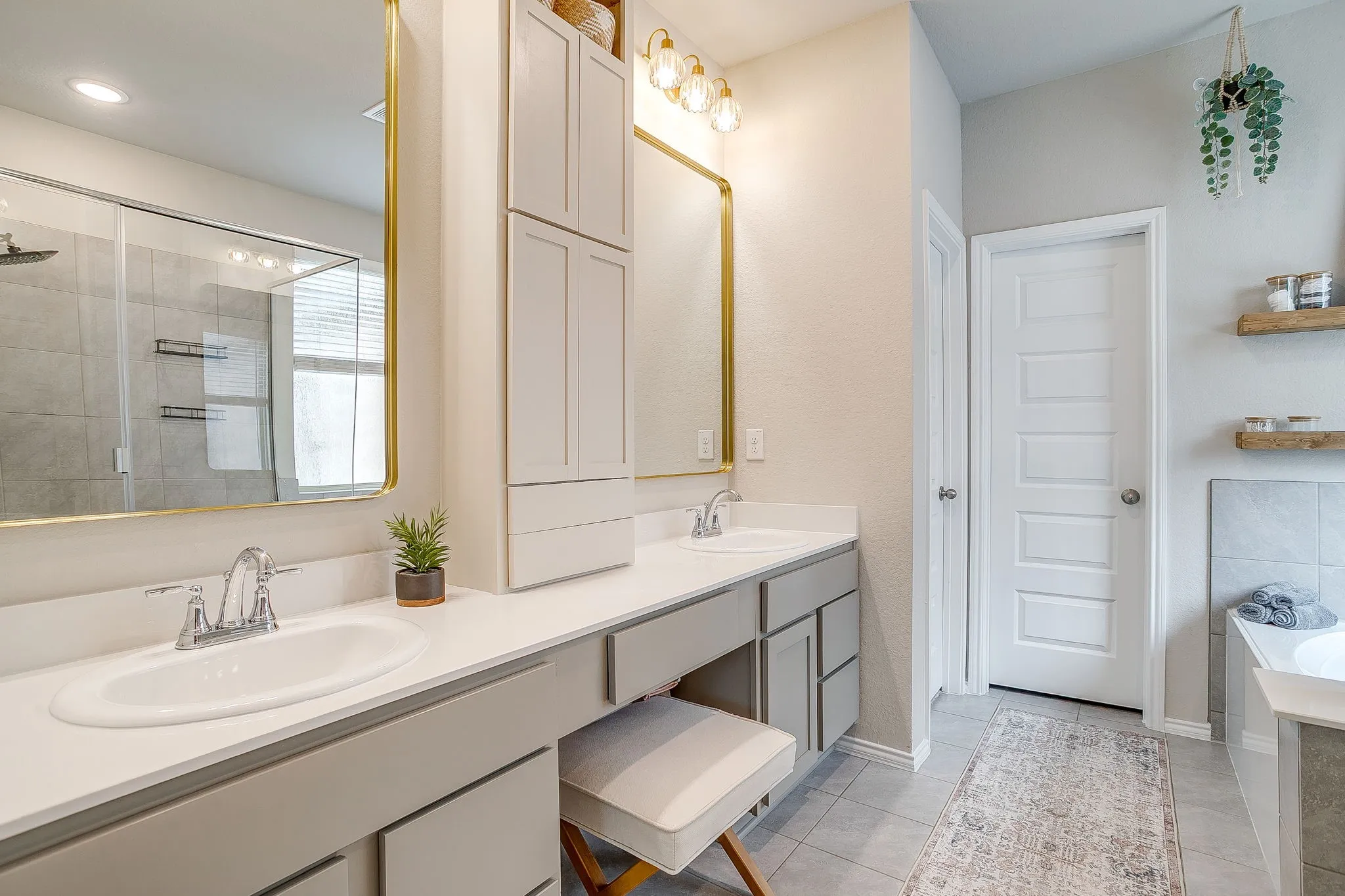 Custom cabinetry, mirrors, and lighting.