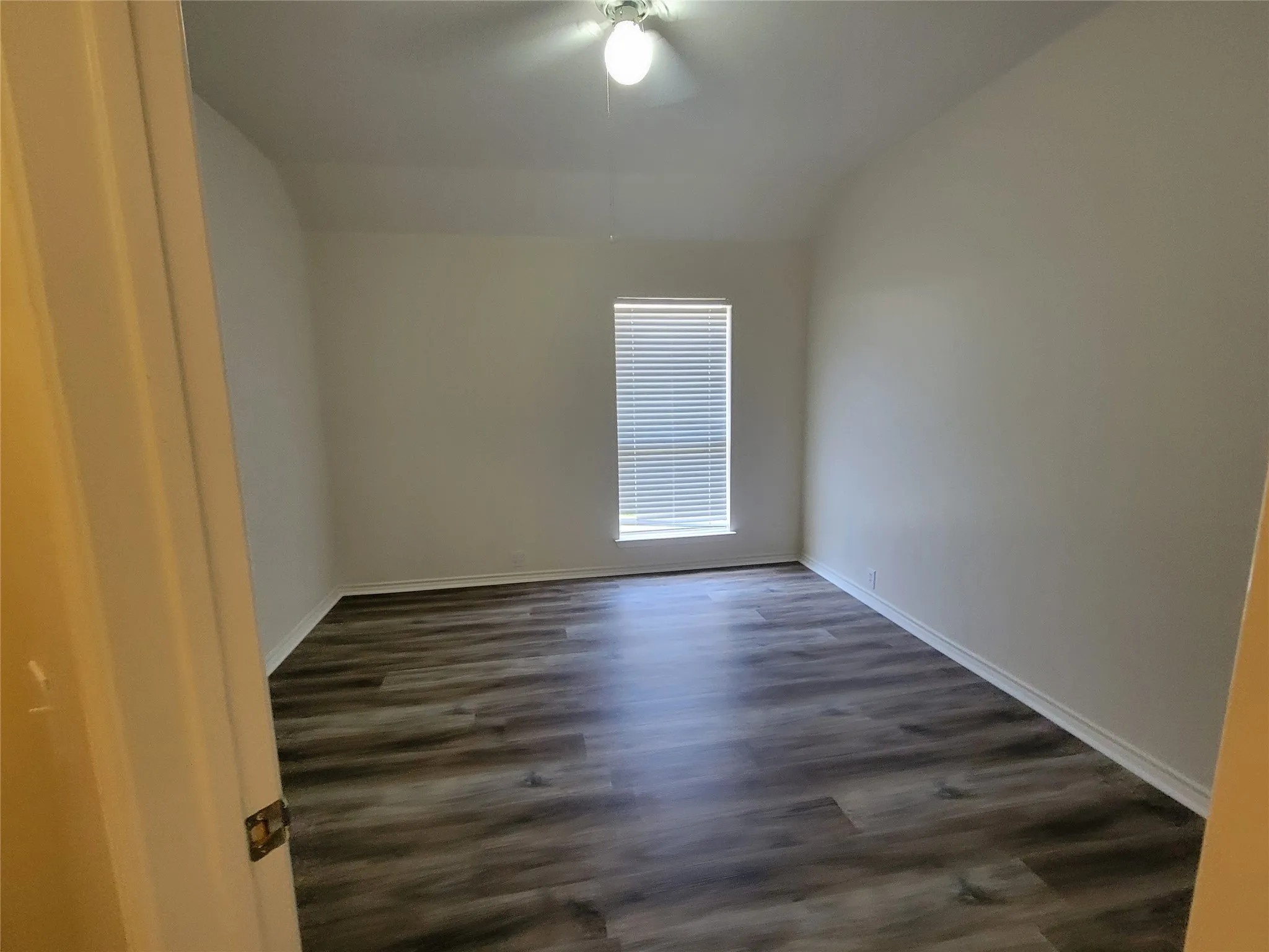 2nd bedroom with walk-in closet and new laminate flooring