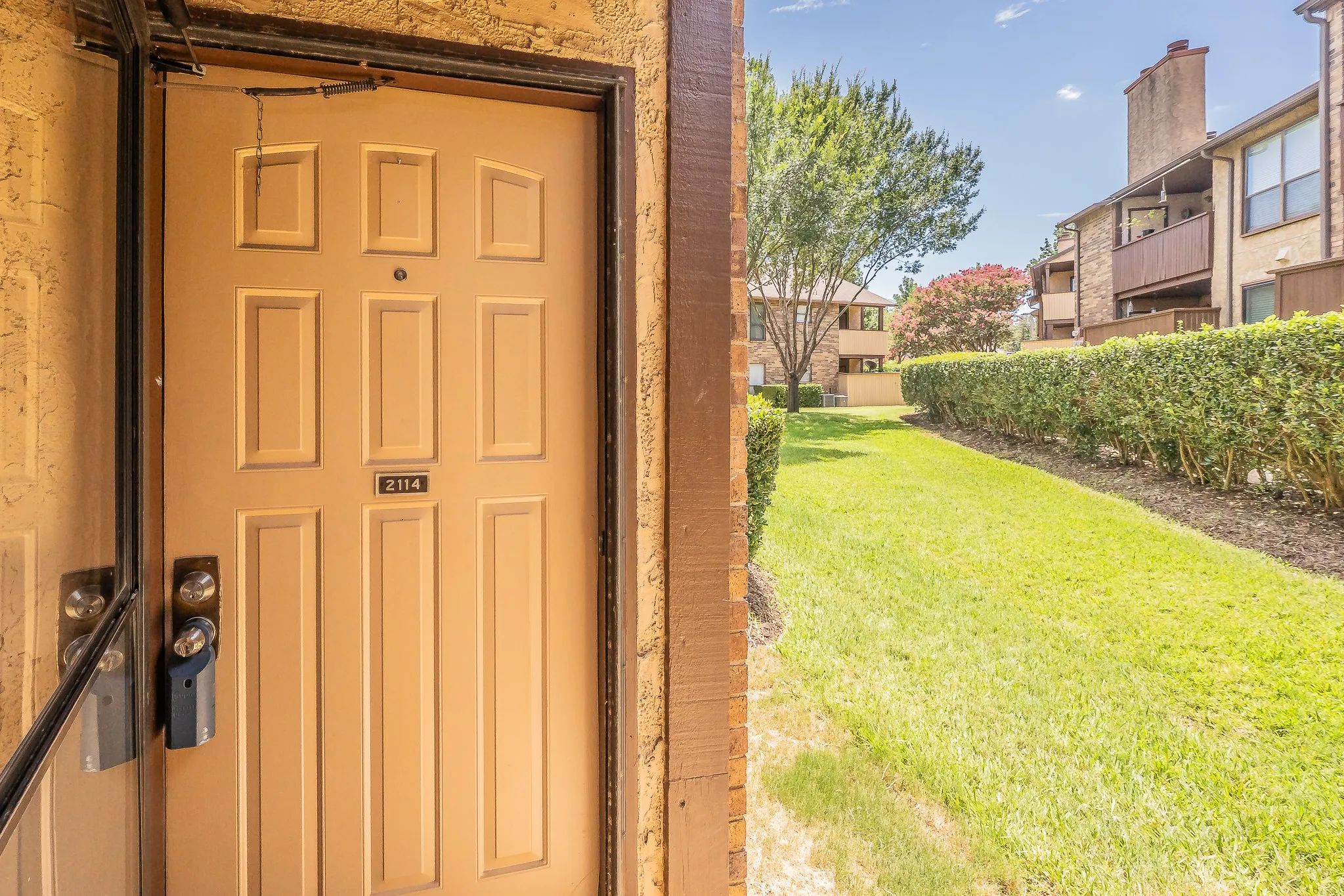 Front door with glass storm door.